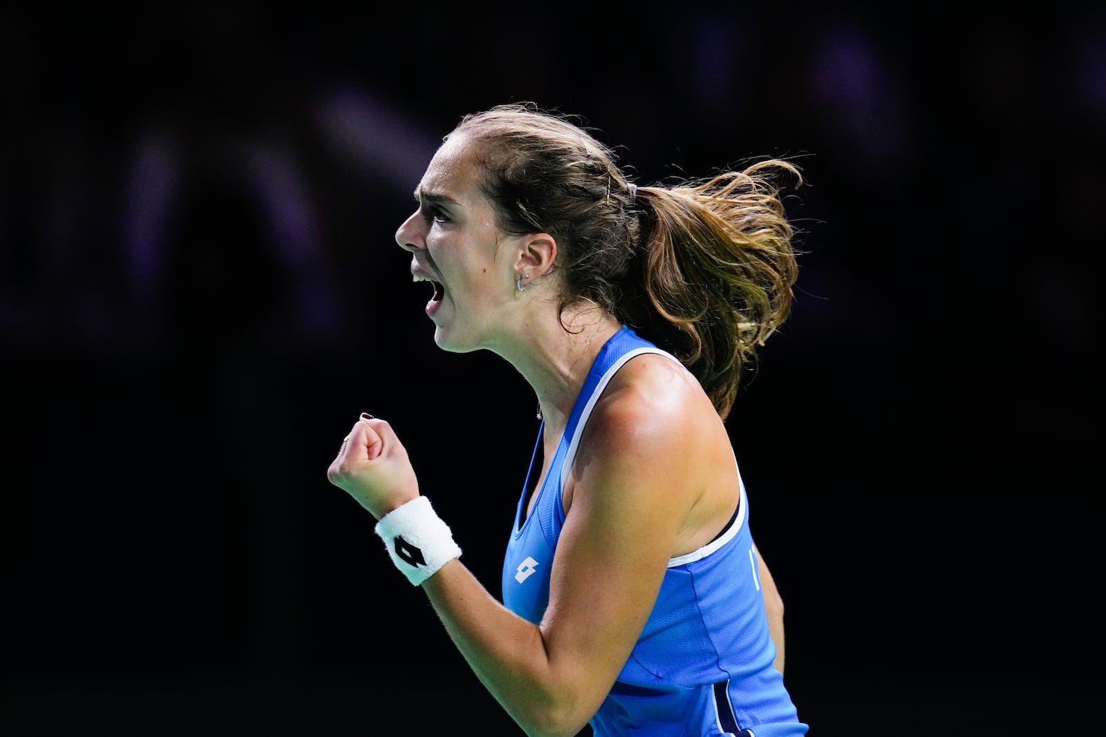 Italy's Lucia Bronzetti celebrates during the Billie Jean King Cup final against Slovakia's Viktoria Hruncakova at the Martin Carpena Sports Hall in Malaga, southern Spain, on Wednesday, Nov. 20, 2024. (AP Photo/Manu Fernandez)