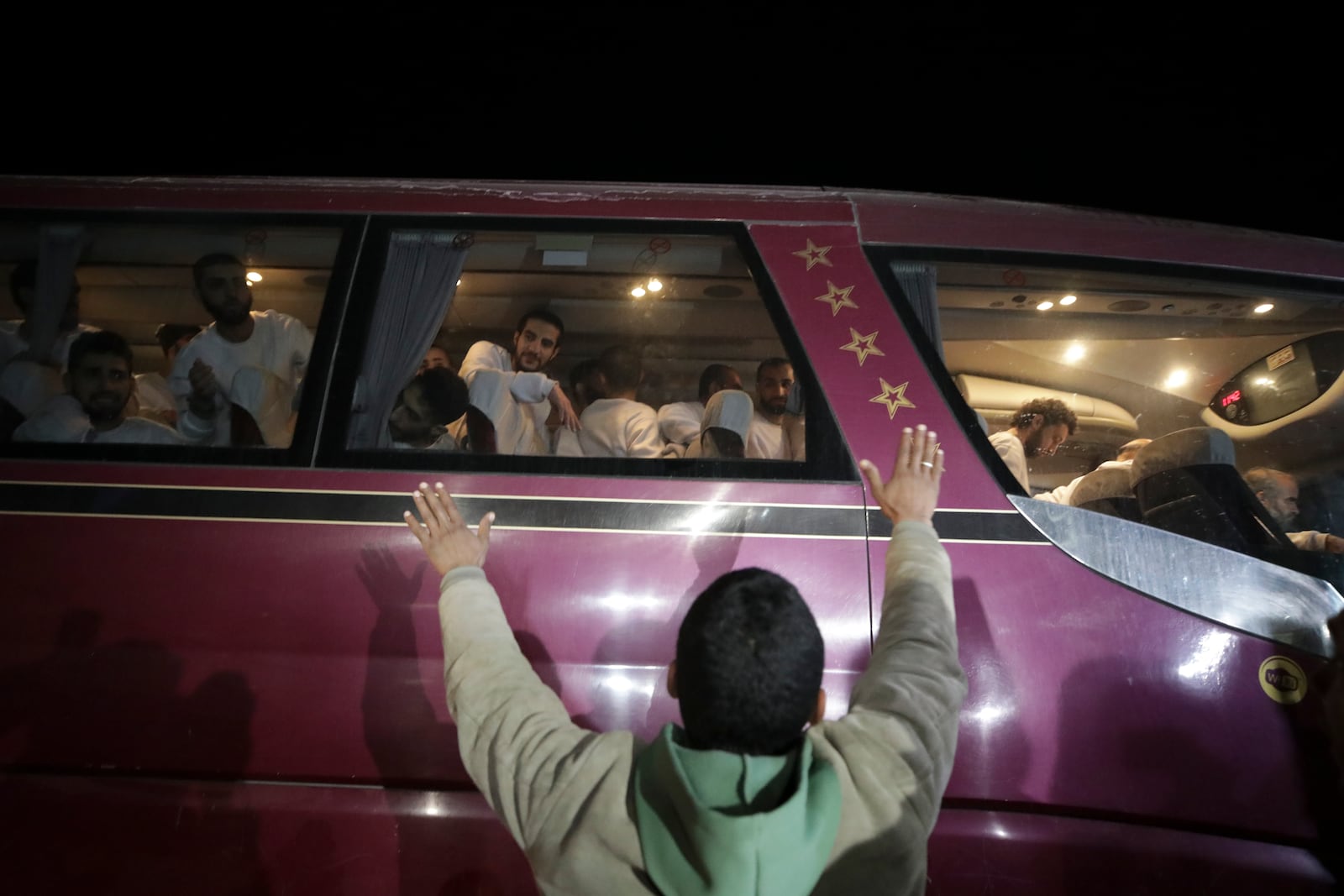 Freed Palestinian prisoners are greeted as they arrive in the Gaza Strip after being released from an Israeli prison following a ceasefire agreement between Hamas and Israel in Khan Younis, Gaza Strip, Thursday, Feb. 27, 2025. (AP Photo/Jehad Alshrafi)