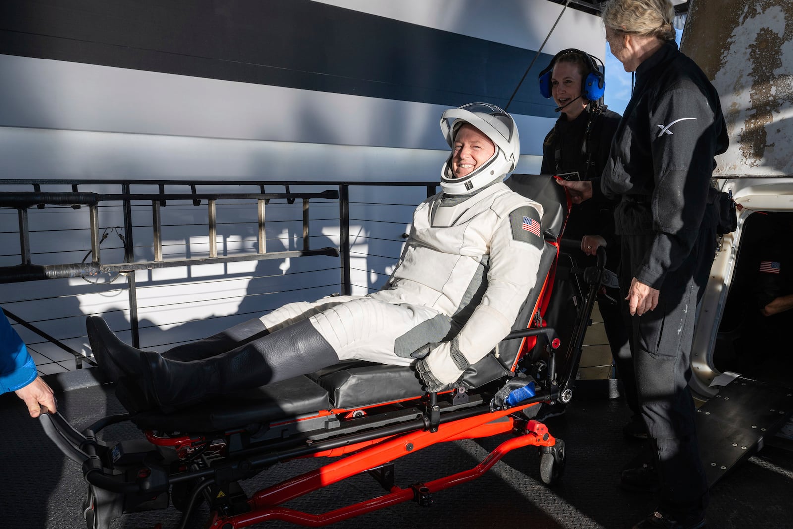 NASA astronaut Butch Wilmore is helped out of a SpaceX capsule onboard the SpaceX recovery ship Megan after landing in the water off the coast of Tallahassee, Fla., Tuesday, March 18, 2025. (Keegan Barber/NASA via AP)