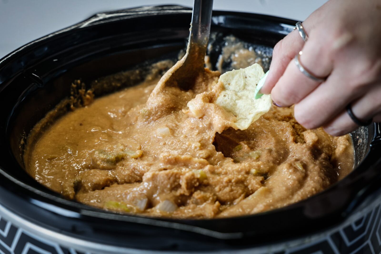 Cox First Media asked readers to submit their very best, easy-to-follow tailgating recipes. Pictured is Craig's Bean Dip sent in by Diana Sanders of Oakwood. JIM NOELKER/STAFF