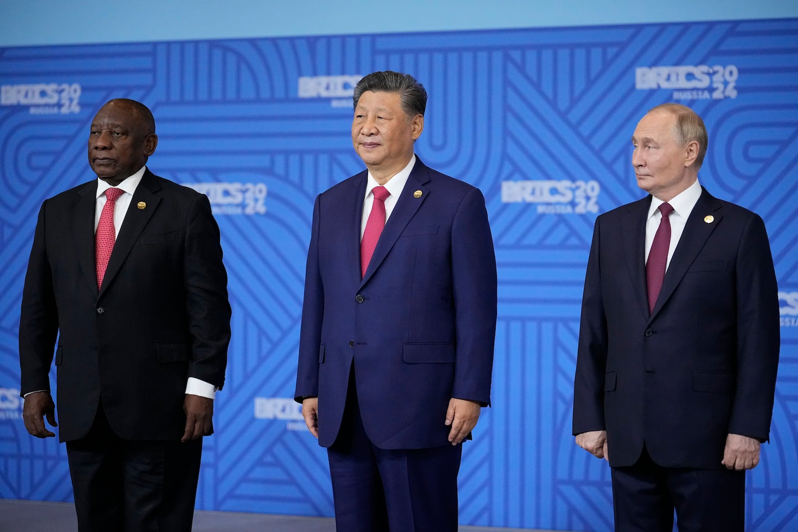 From left: South African President Cyril Ramaphosa, Chinese President Xi Jinping and Russian President Vladimir Putin pose for a family photo prior to the BRICS Summit plenary session in Kazan, Russia, Wednesday, Oct. 23, 2024. (AP Photo/Alexander Zemlianichenko, Pool)