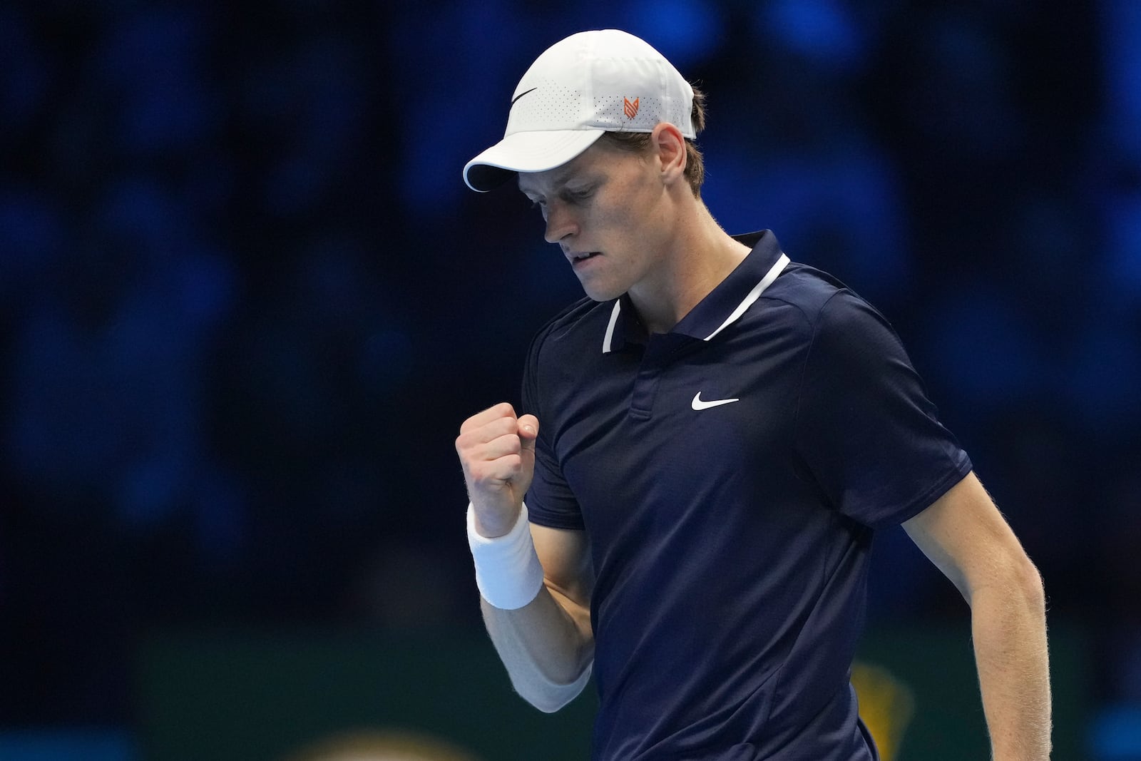 Italy's Jannik Sinner reacts during a semifinal tennis match of the ATP World Tour Finals against Norway's Casper Ruud at the Inalpi Arena in Turin, Italy, Saturday, Nov. 16, 2024. (AP Photo/Antonio Calanni)