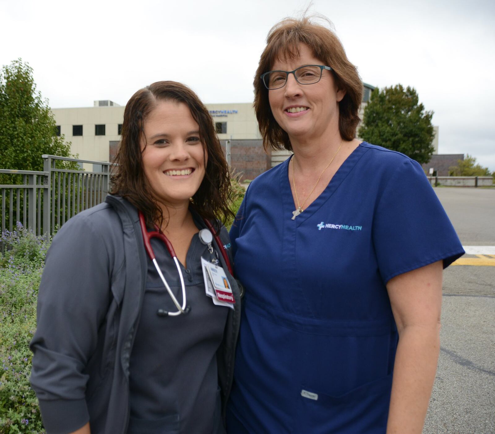 Amber Preston, a respiration therapist at Mercy Hospital-Fairfield, (left) and Kathy Harvey, a registered nurse at Mercy Hospital-Fairfield, saved the life of Steve Moore, a Fairfield resident who collapsed outside the Mercy HealthPlex on the Fairfield hospital’s Mack Road campus. MICHAEL D. PITMAN/STAFF