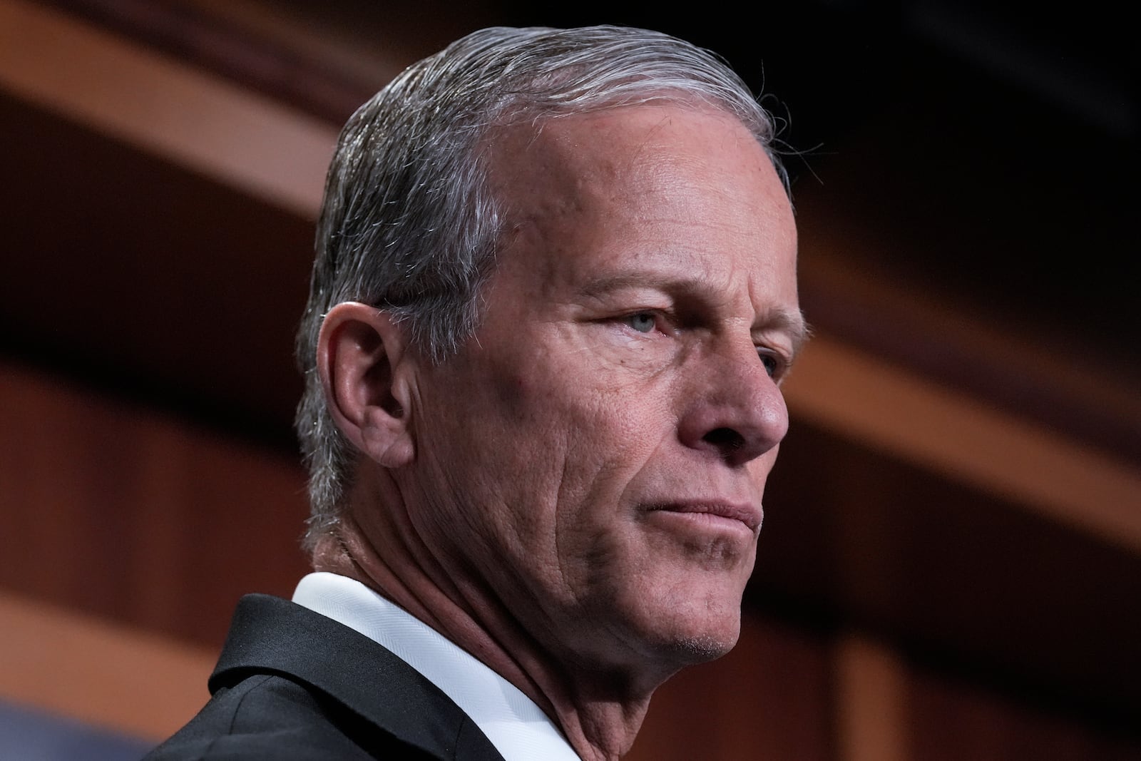 Senate Majority Leader John Thune, R-S.D., listens as Republican senators talk to reporters about the Laken Riley Act, a bill to detain unauthorized immigrants who have been accused of certain crimes, at the Capitol in Washington, Thursday, Jan. 9, 2025. Georgia nursing student Laken Riley was killed last year by a Venezuelan man who entered the U.S. illegally and was allowed to stay to pursue his immigration case. (AP Photo/J. Scott Applewhite)