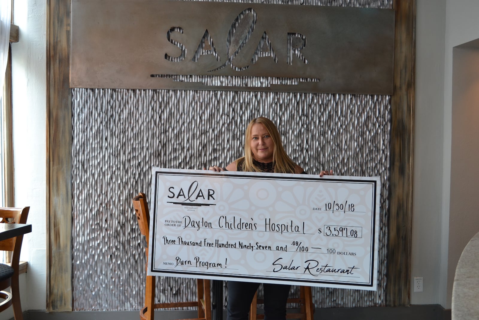 Salar Restaurant and Lounge, 400 E. Fifth St. in Dayton’s Oregon District, has donated $3,600 to Dayton Children’s Hospital Burn Program.