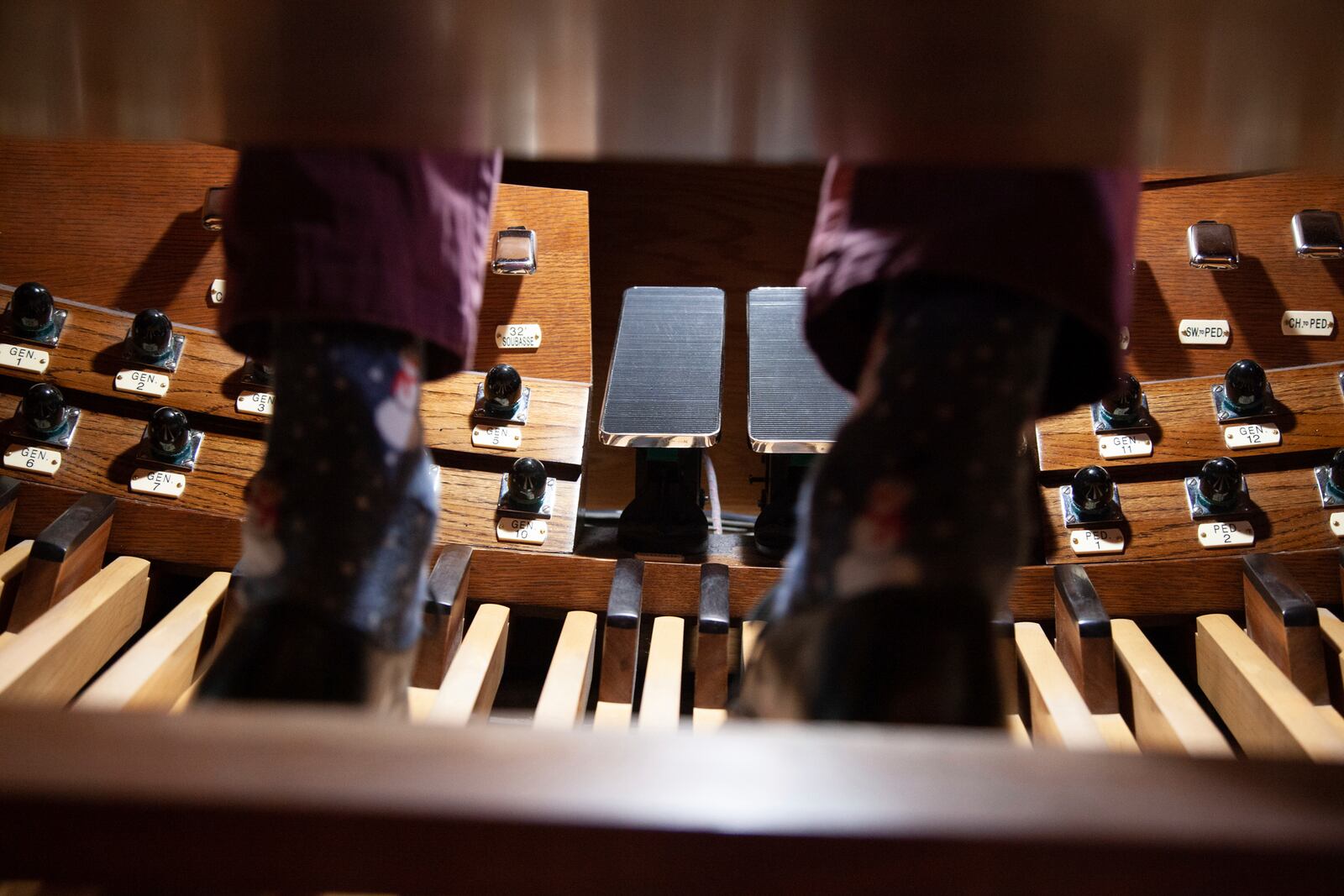 Colin MacKnight, music director at Trinity Episcopal Cathedral in Little Rock, Arkansas, rehearses songs from Johann Sebastian Bach, Tuesday, Jan. 21, 2025, using the pedal-board, a part of the organ played with the musician's feet. (AP Photo/Katie Adkins)