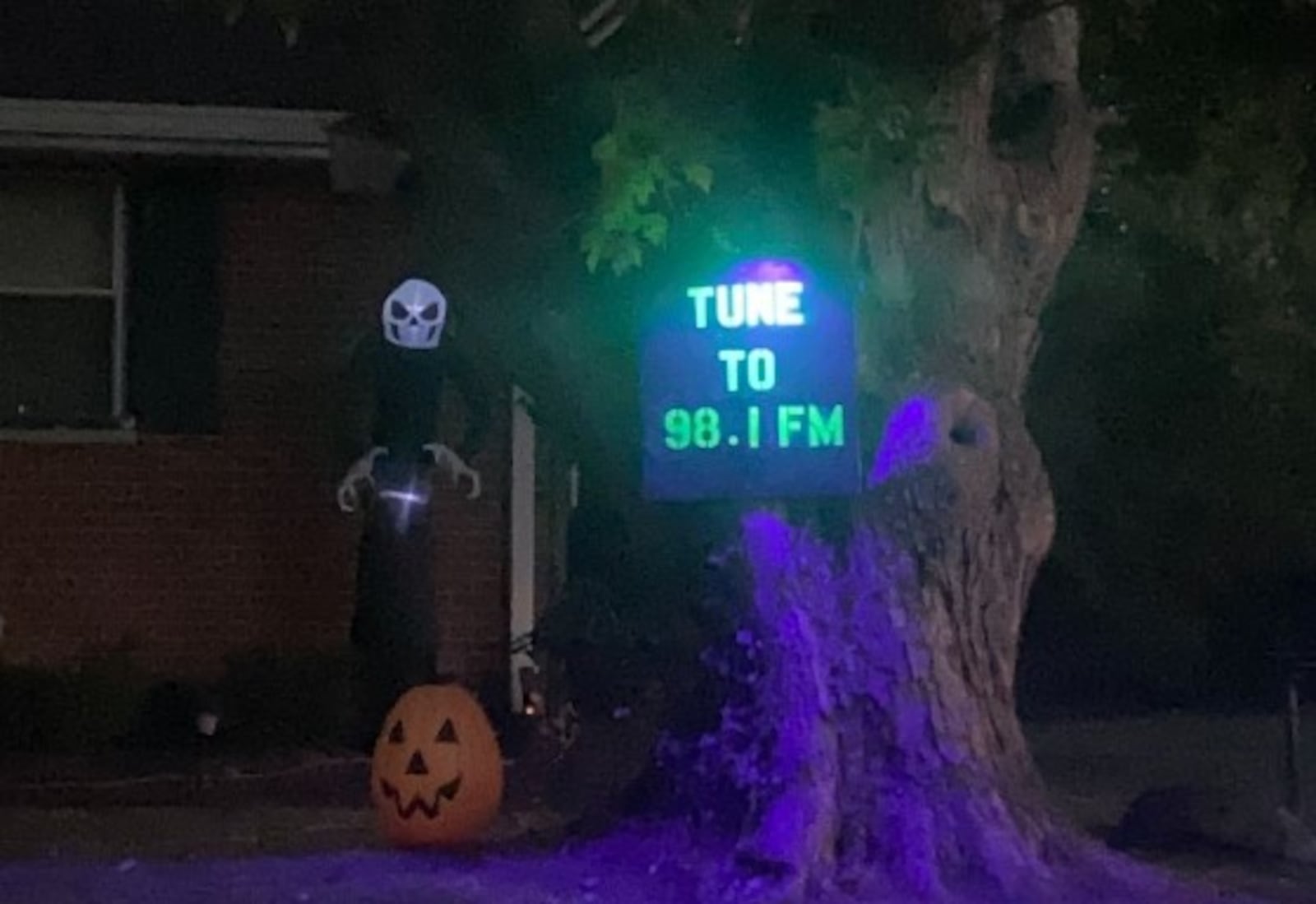 The Gardner home on Miami Western Drive in Oxford is complete with more than 2,500 individual pixels of light, backed by a fog machine flowing over a row of tombstones, and is flanked by a set of inflatable Halloween characters. TAJ SIMMONS/CONTRIBUTED