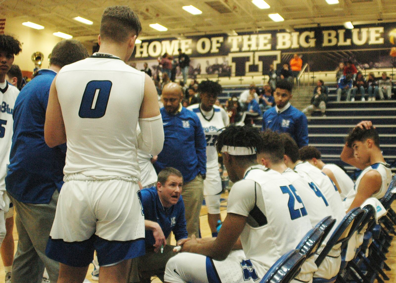 Hamilton coach Kevin Higgins talks to his team during a timeout Tuesday night at the Hamilton Athletic Center. Host Big Blue defeated Fairfield 70-57. RICK CASSANO/STAFF