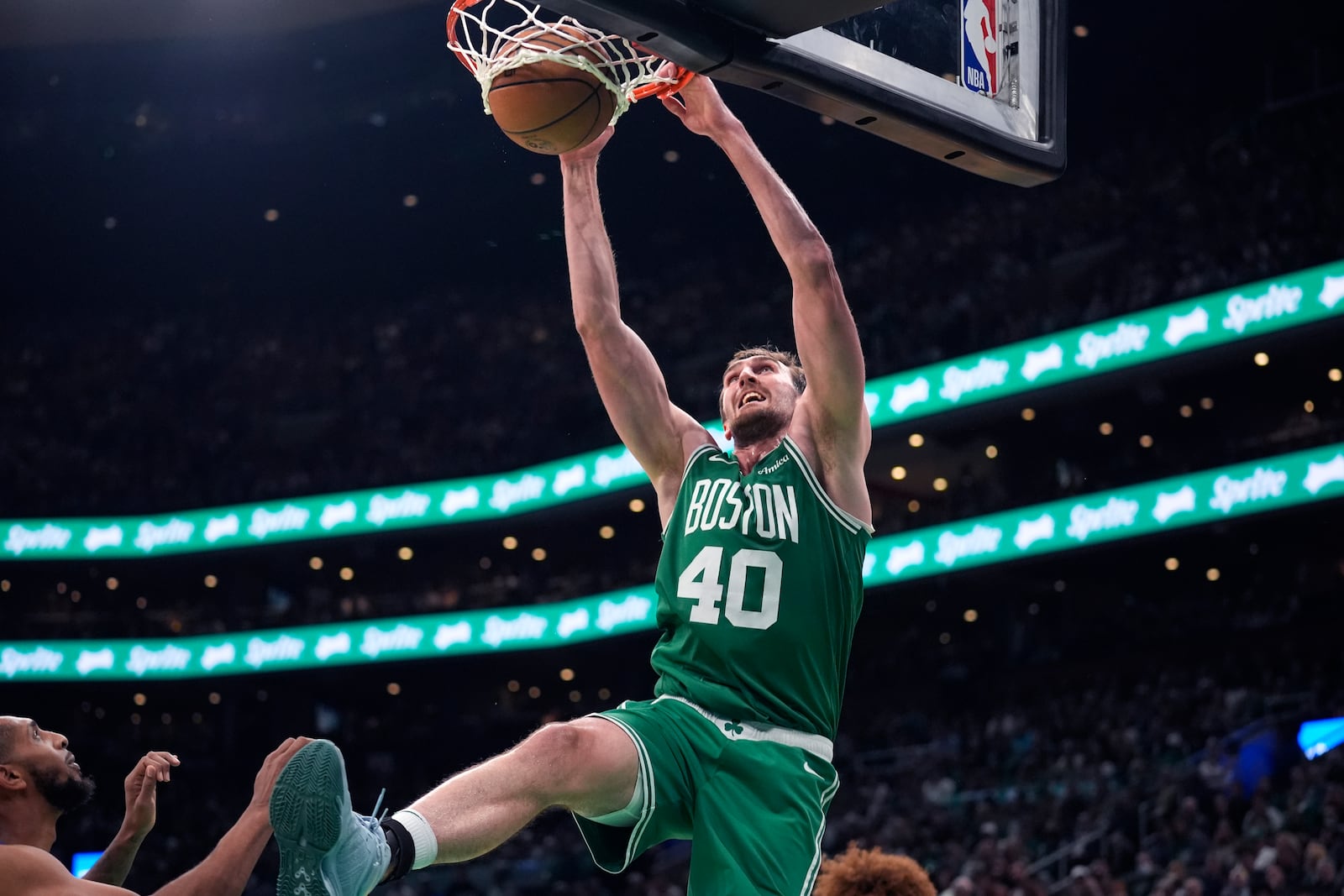 Boston Celtics center Luke Kornet (40) slams a dunk against the New York Knicks during the second half of an NBA basketball game, Tuesday, Oct. 22, 2024, in Boston. (AP Photo/Charles Krupa)