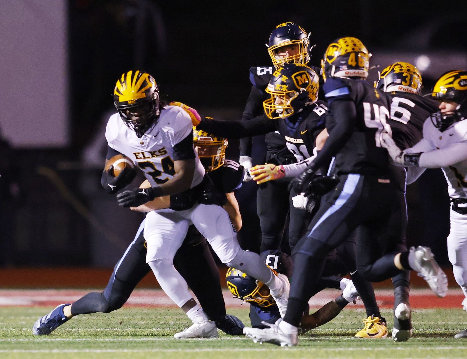 Centerville's Ziere Alston carries the ball during their Division I state semifinal football game against Moeller Friday, Nov. 29, 2024 at Princeton High School in Sharonville. Moeller won 49-10 to advance. NICK GRAHAM/STAFF