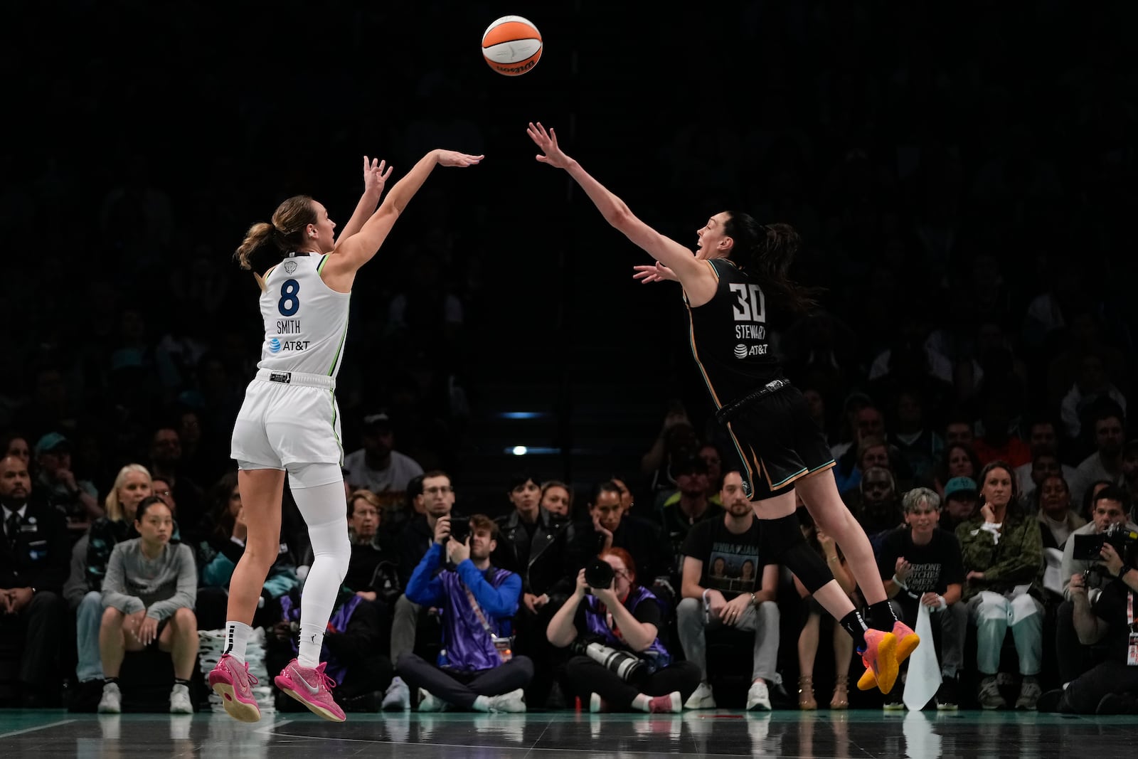 Minnesota Lynx forward Alanna Smith (8) puts up a shot against New York Liberty forward Breanna Stewart (30) during the first quarter of Game 5 of the WNBA basketball final series, Sunday, Oct. 20, 2024, in New York. (AP Photo/Pamela Smith)