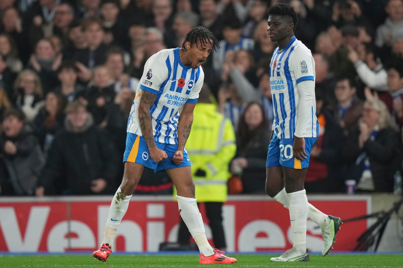 Brighton's Joao Pedro, left, celebrates after scoring during the English Premier League soccer match between Brighton and Manchester City at Falmer Stadium in Brighton, England, Saturday, Nov. 9, 2024. (AP Photo/Alastair Grant)