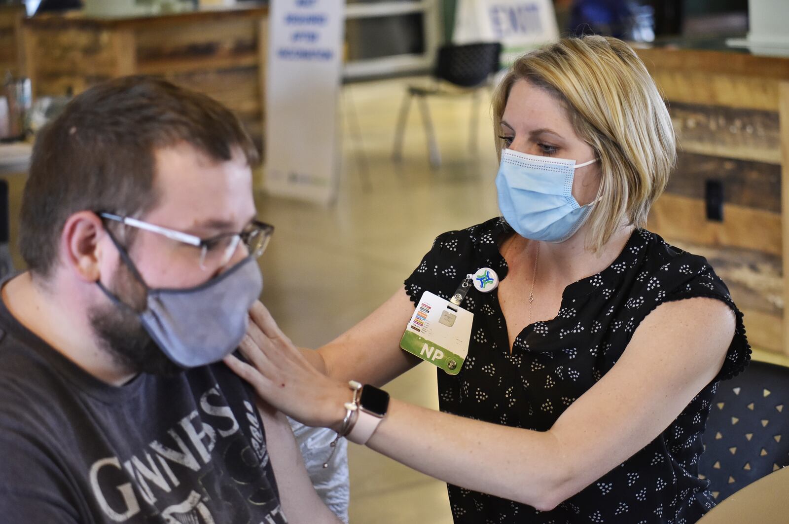 Kendra Chesnut, right, from Mercy Health, gives a vaccine to Matt Seiter. Mercy Health-Fairfield Hospital offered first-dose vaccinations at Jungle Jim's Oscar Event Center in Fairfield Tuesday, April 6, 2021, and will offer them from 9 a.m. to 2 p.m. Wednesday, April 7, 2021. It's estimated 1,200 people, 600 on Tuesday and 600 on Wednesday, will receive the first-shot of the novel coronavirus vaccine. NICK GRAHAM / STAFF