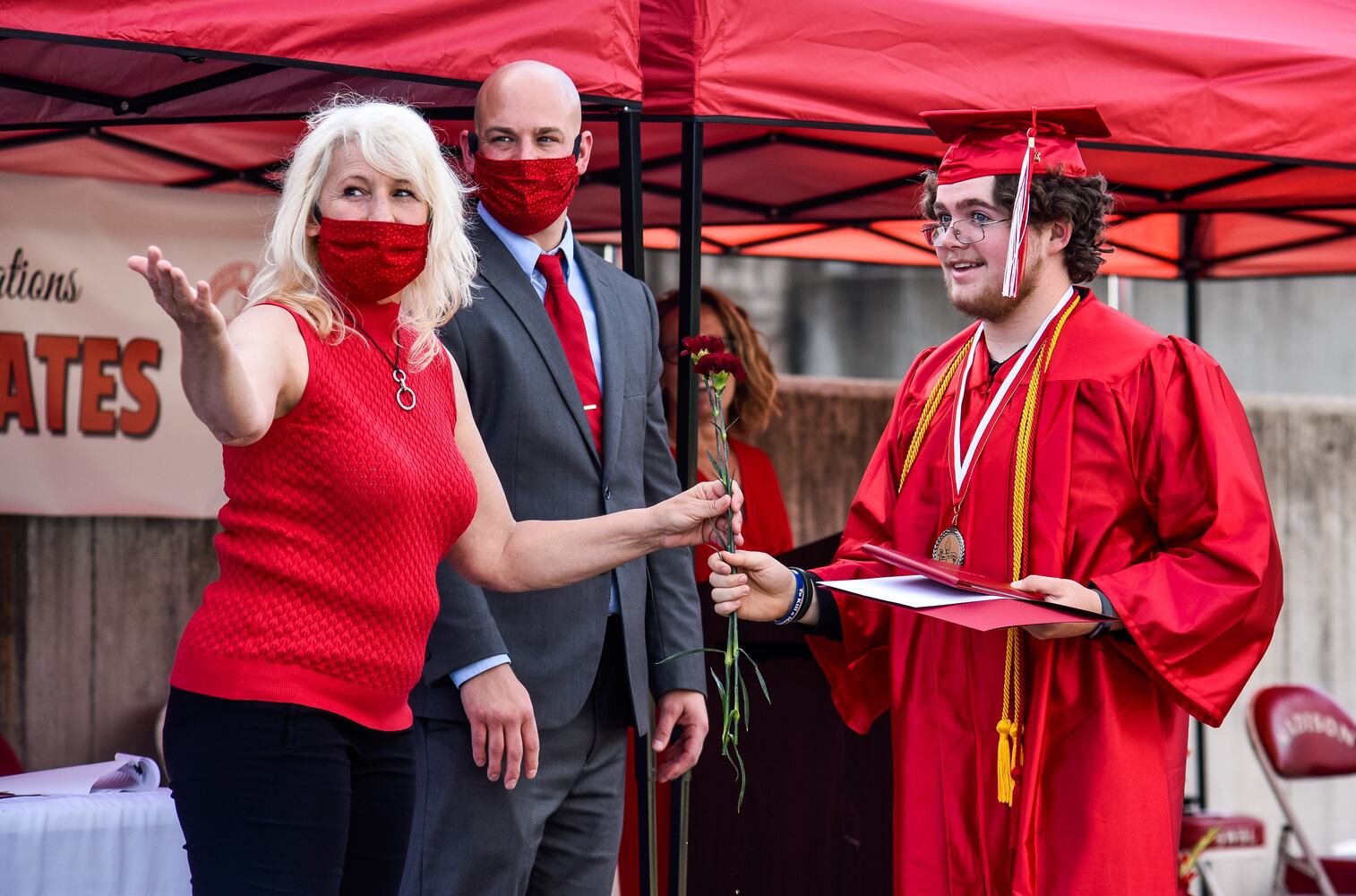 Madison High School drive-thru graduation ceremony at Land of Illusion