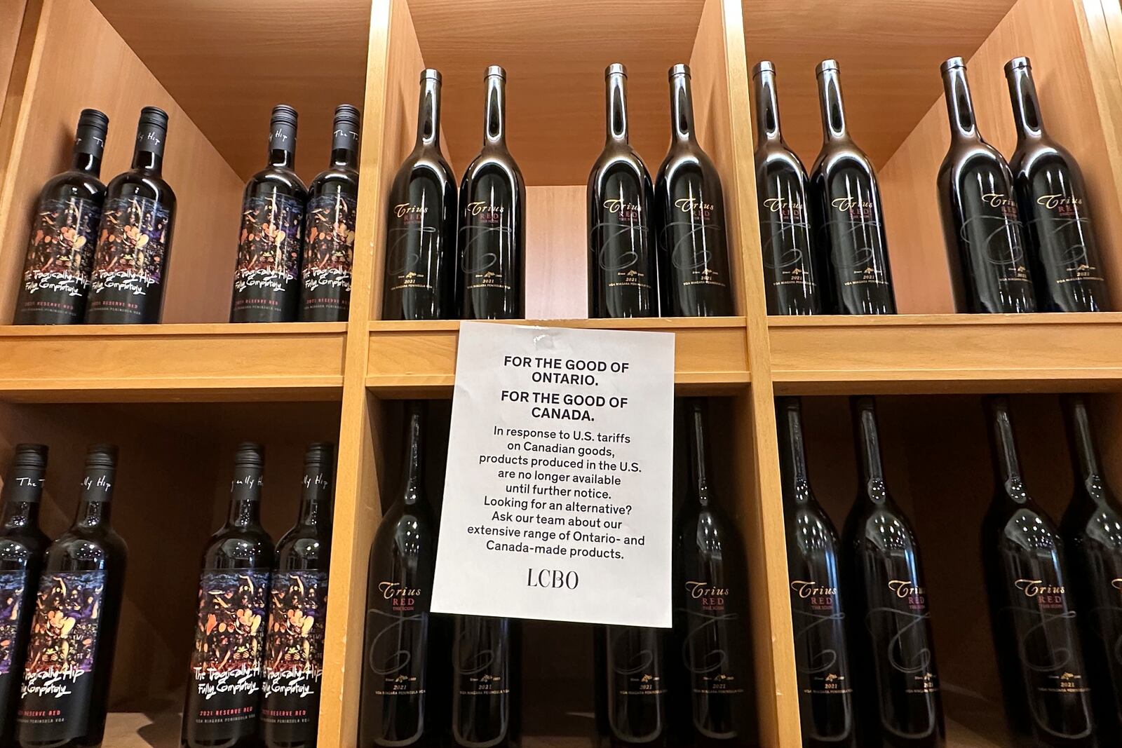 A sign is posted on a wine shelves at an LCBO, the government-run liquor stores where most wine and spirits in the province are purchased, Sunday, March 9, 2025, in Toronto. (AP Photo/Jill Colvin)