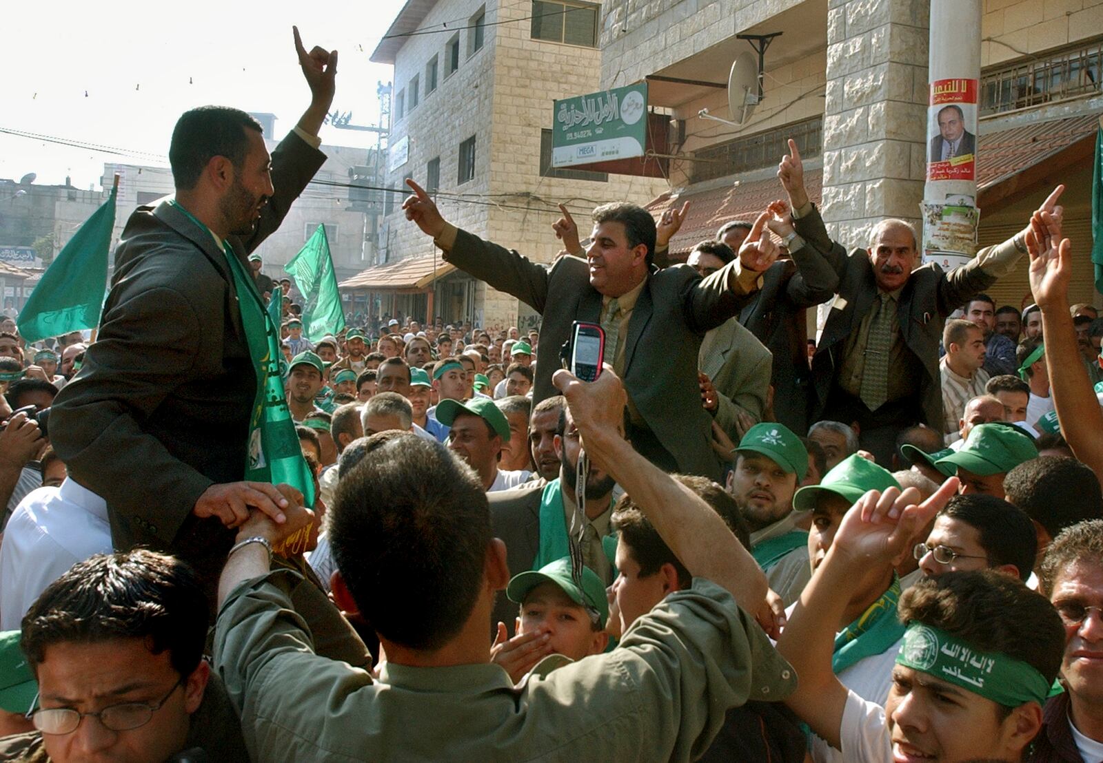 FILE - Supporters and candidates to the local elections of the Islamic group Hamas clebrate their victory in the West Bank town of Qalqilya, on May 6, 2005. (AP Photo/Nasser Ishtayeh, File)