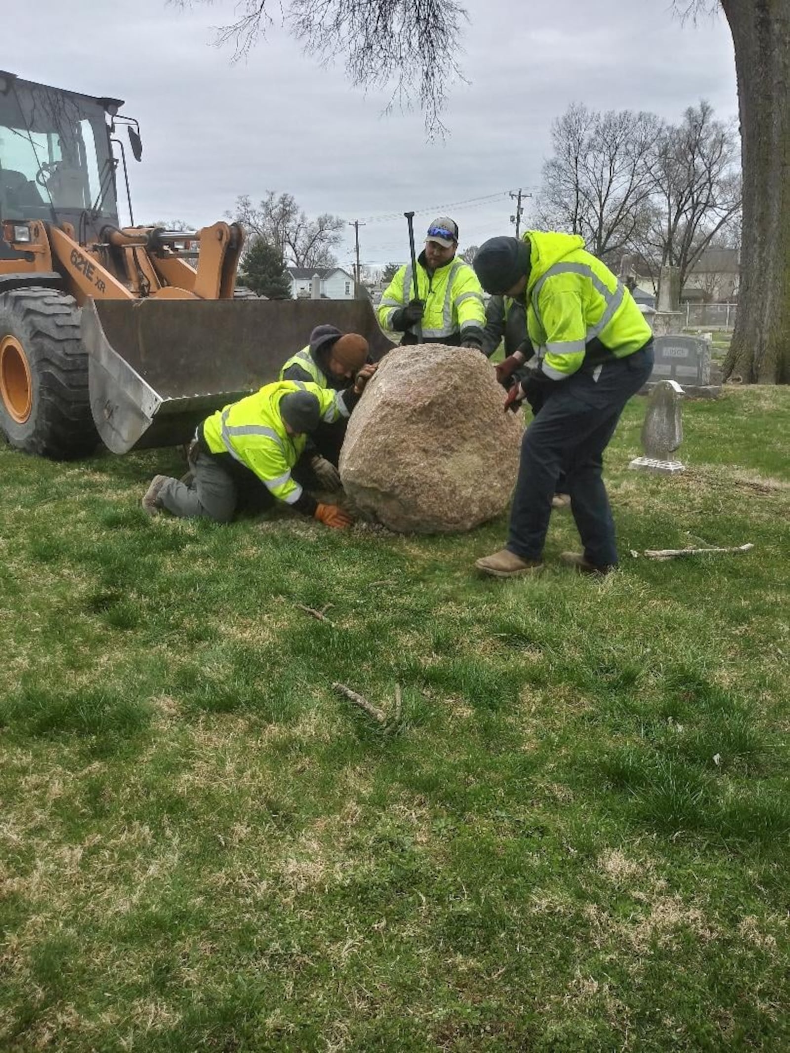 City of Middletown employees recently set a rock at the Middletown Cemetery on First Avenue that will honor the 233 veterans buried there. SUBMITTED PHOTO