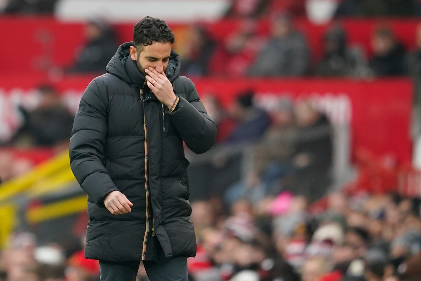 Manchester United's head coach Ruben Amorim follows the game during the English Premier League soccer match between Manchester United and Brighton and Hove Albion, at the Old Trafford stadium in Manchester, England, Sunday, Jan. 19, 2025. (AP Photo/Dave Thompson)