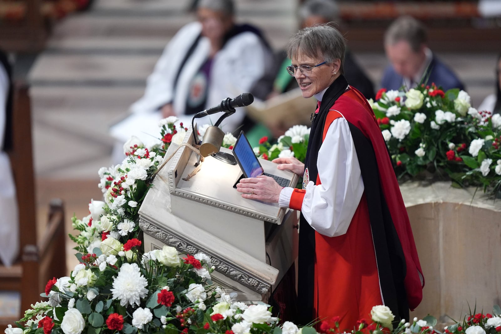 Rev. Mariann Budde leads the national prayer service attended by President Donald Trump at the Washington National Cathedral, Tuesday, Jan. 21, 2025, in Washington. (AP Photo/Evan Vucci)