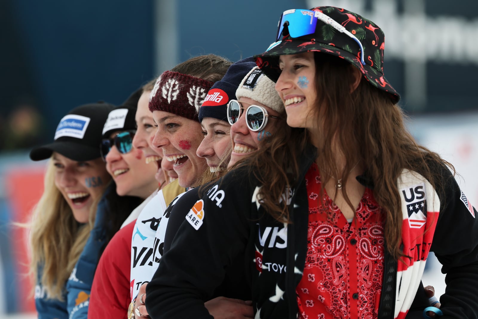 From left, United States' Paula Moltzan, Jacqueline Wiles, A.J. Hurt, Breezy Johnson, Mikaela Shiffrin, Katie Hensien and Lauren Macuga celebrates at the finish area after Johnson and Shiffrin won the gold medal in a women's team combined event, at the Alpine Ski World Championships, in Saalbach-Hinterglemm, Austria, Tuesday, Feb. 11, 2025. (AP Photo/Marco Trovati)