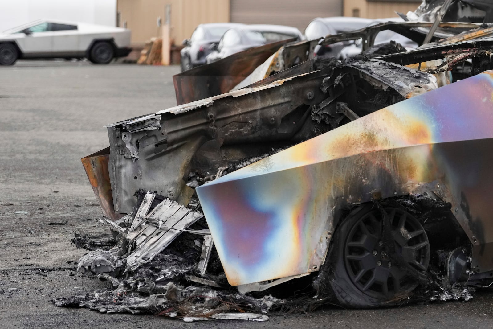 FILE - A burned Tesla Cybertruck is parked at a Tesla lot in Seattle, Monday, March 10, 2025. (AP Photo/Lindsey Wasson, File)