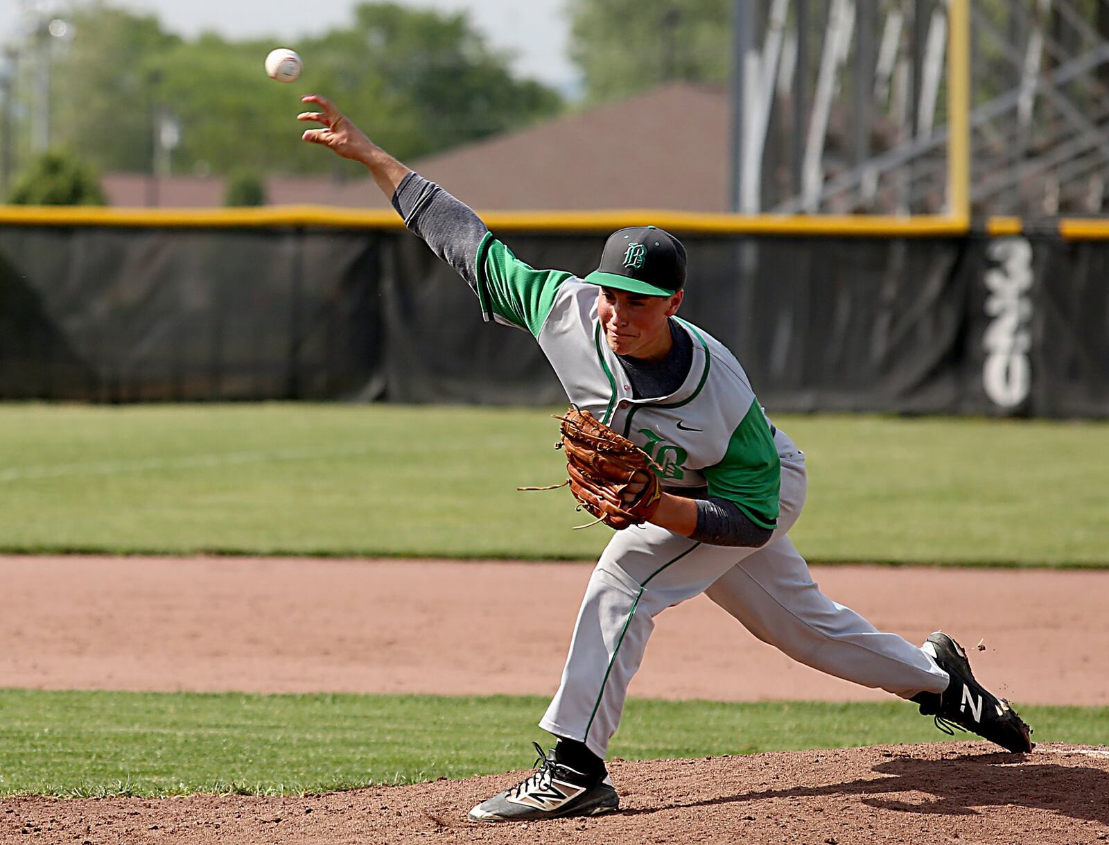 Badin pitcher Seth Klaiber sends the ball toward the plate Thursday during a Division II sectional final against Chaminade Julienne at Miamisburg. CONTRIBUTED PHOTO BY E.L. HUBBARD