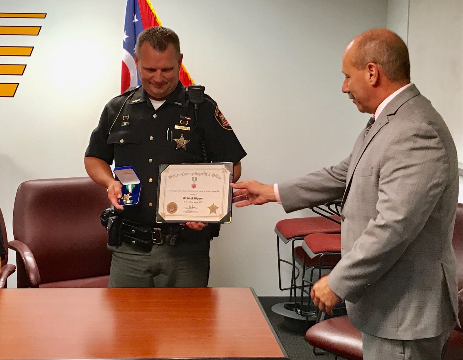 Butler County sheriff’s deputy Mike Gipson (left) received the department’s Life-Saving Award on Monday.