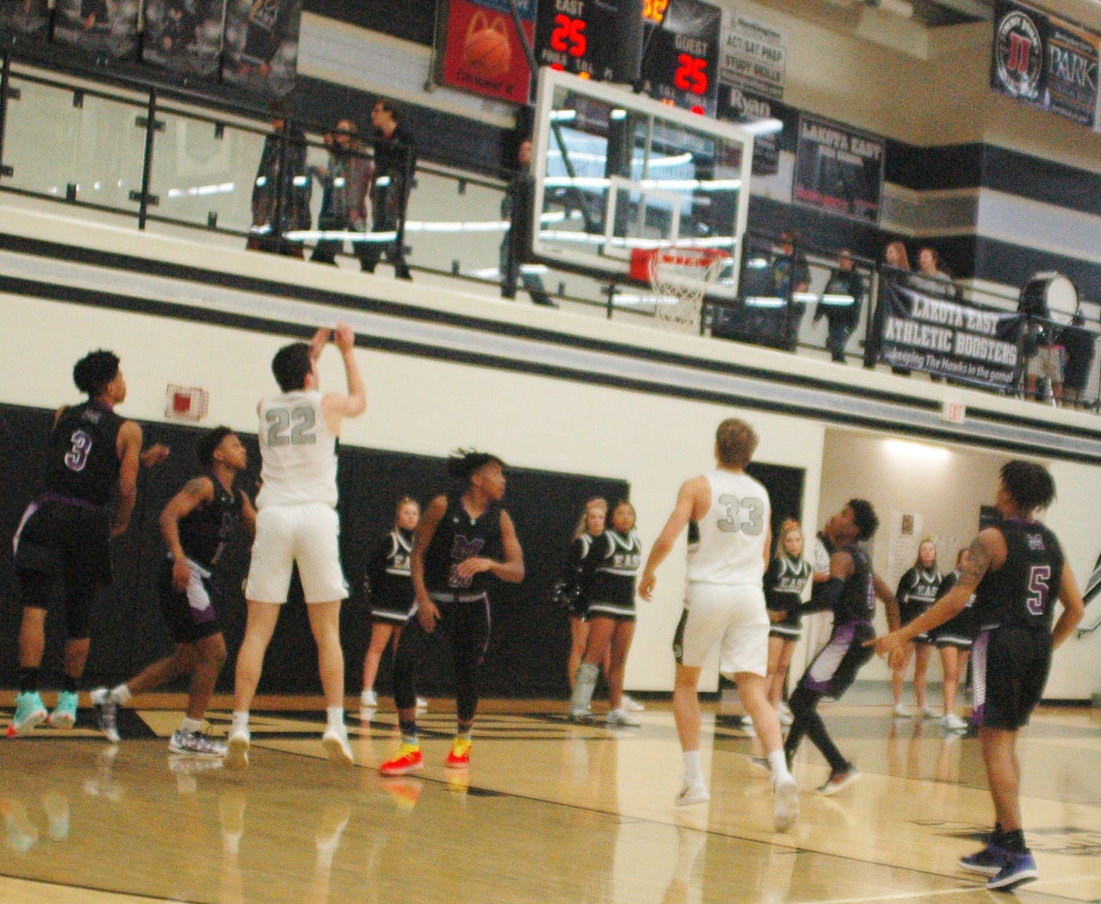 Lakota East’s Bash Wieland (22) puts up a shot between Middletown’s Johrdon Mumford (20) and Kei’Aunte Powell (3) during Tuesday night’s game at East. The host Thunderhawks won 64-54. RICK CASSANO/STAFF