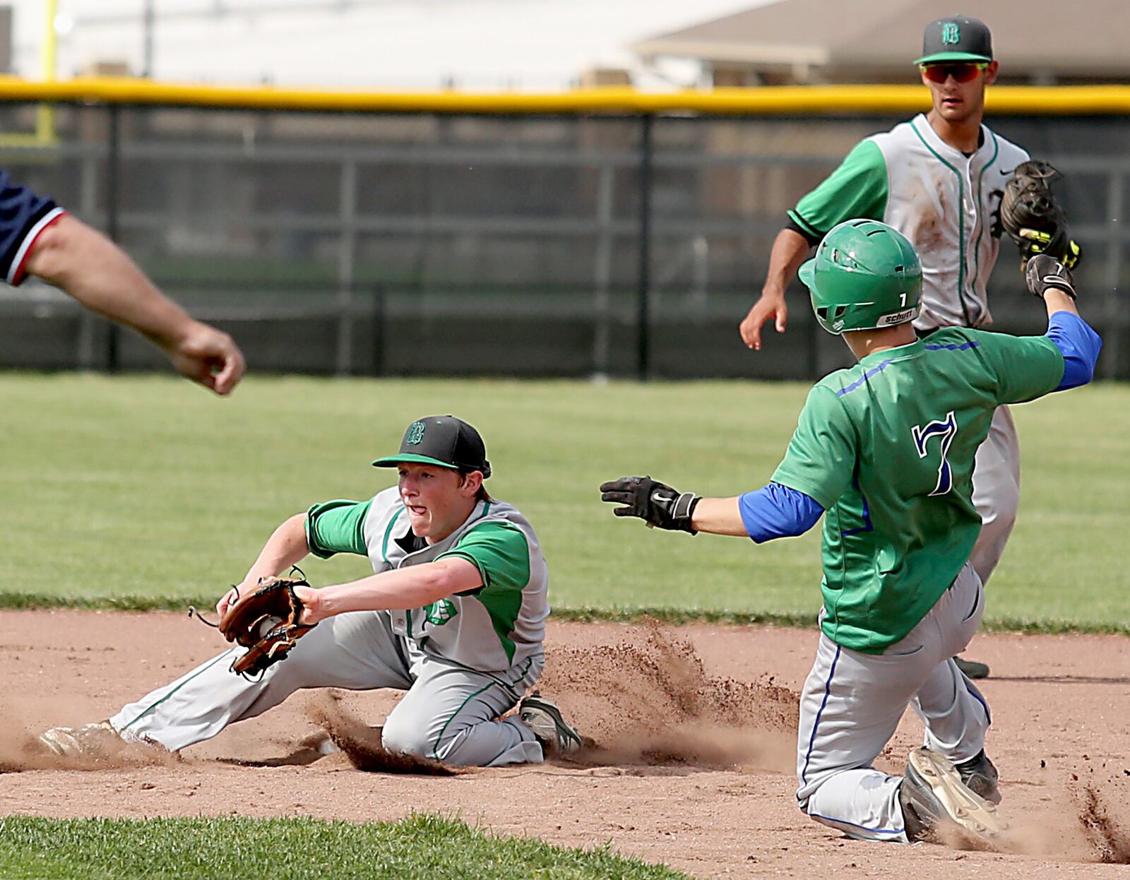 Badin second baseman Andrew Holderbach takes the throw as Chaminade Julienne’s Mark Barhorst steals second during their Division II sectional final at Miamisburg on Thursday. CONTRIBUTED PHOTO BY E.L. HUBBARD