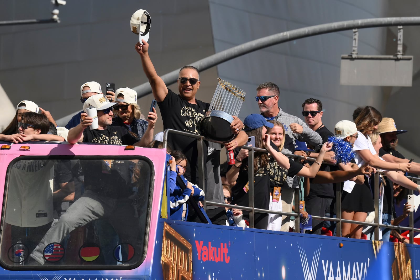 Los Angeles Dodgers manager Dave Roberts tips his hat to the crowd during the baseball team's World Series championship parade Friday, Nov. 1, 2024, in Los Angeles. (AP Photo/Kyusung Gong)