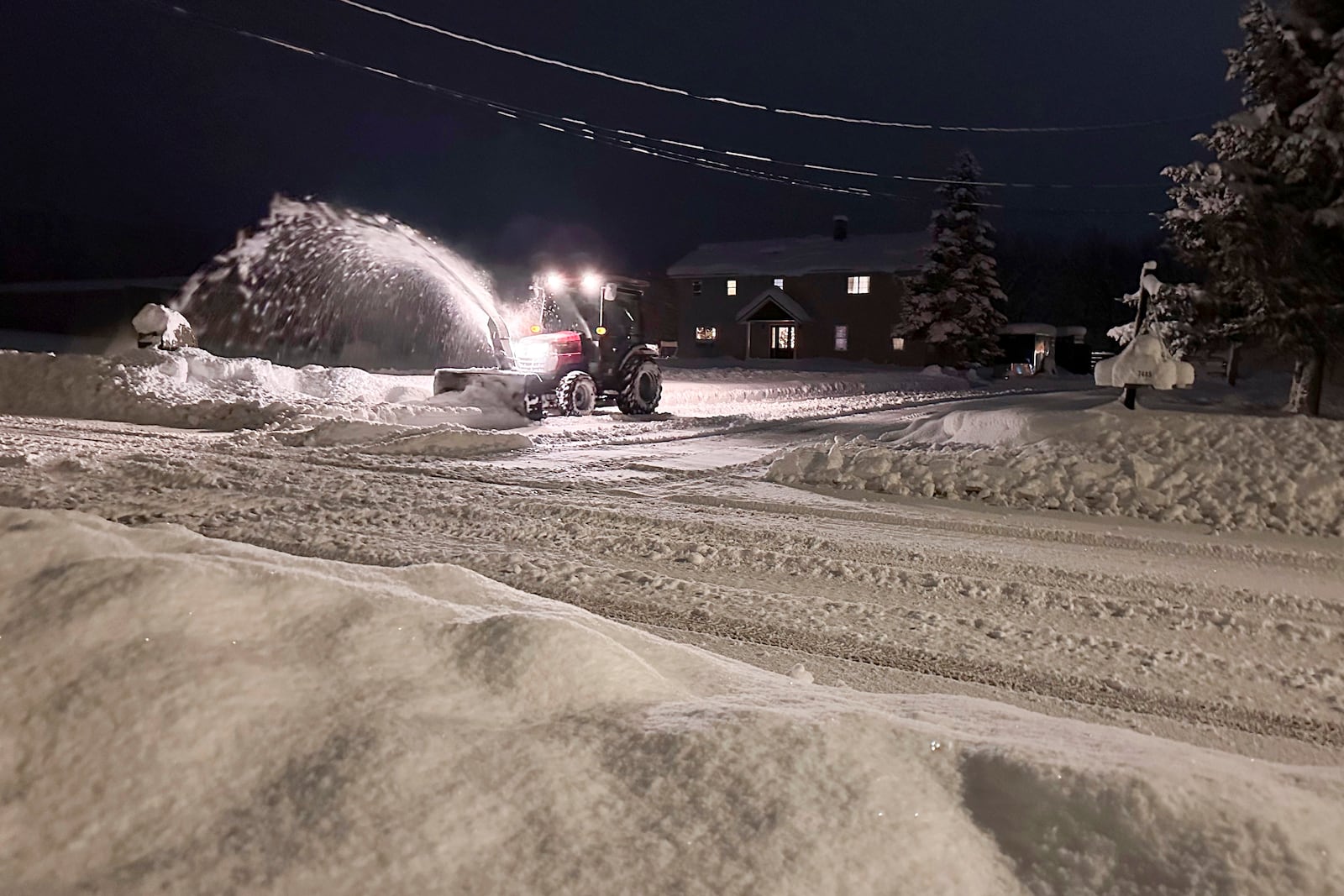 A snowplow operates in Lowville, N.Y., on Sunday, Dec. 1, 2024. (AP Photo/Cara Anna)