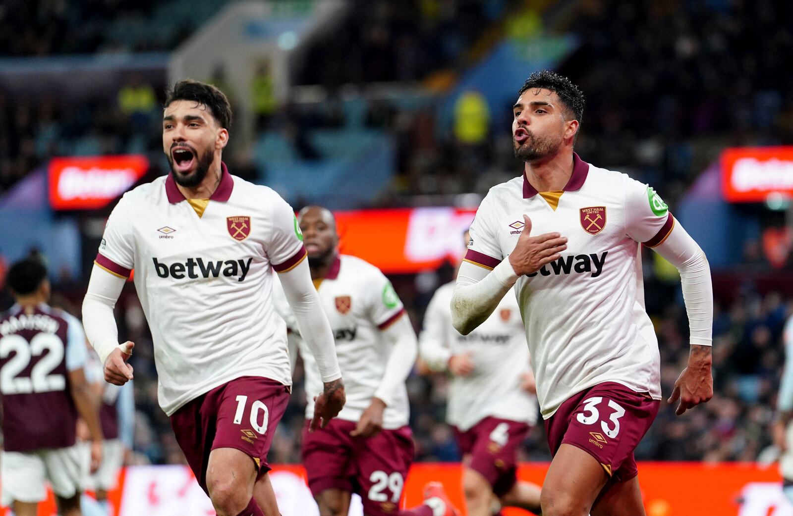 West Ham United's Emerson Palmieri, right, celebrates scoring their side's first goal of the game during the English Premier League soccer match between Aston Villa and West Ham United at Villa Park, in Birmingham, England, Sunday, Jan. 26, 2025. (David Davies/PA via AP)