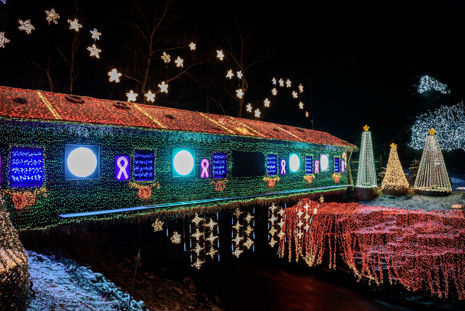 The historic Clifton Mill, built in 1802 and still working, opened its Legendary Lights for the 2018 holiday season on Friday, Nov. 23. CONTRIBUTED BY TOM GILLIAM