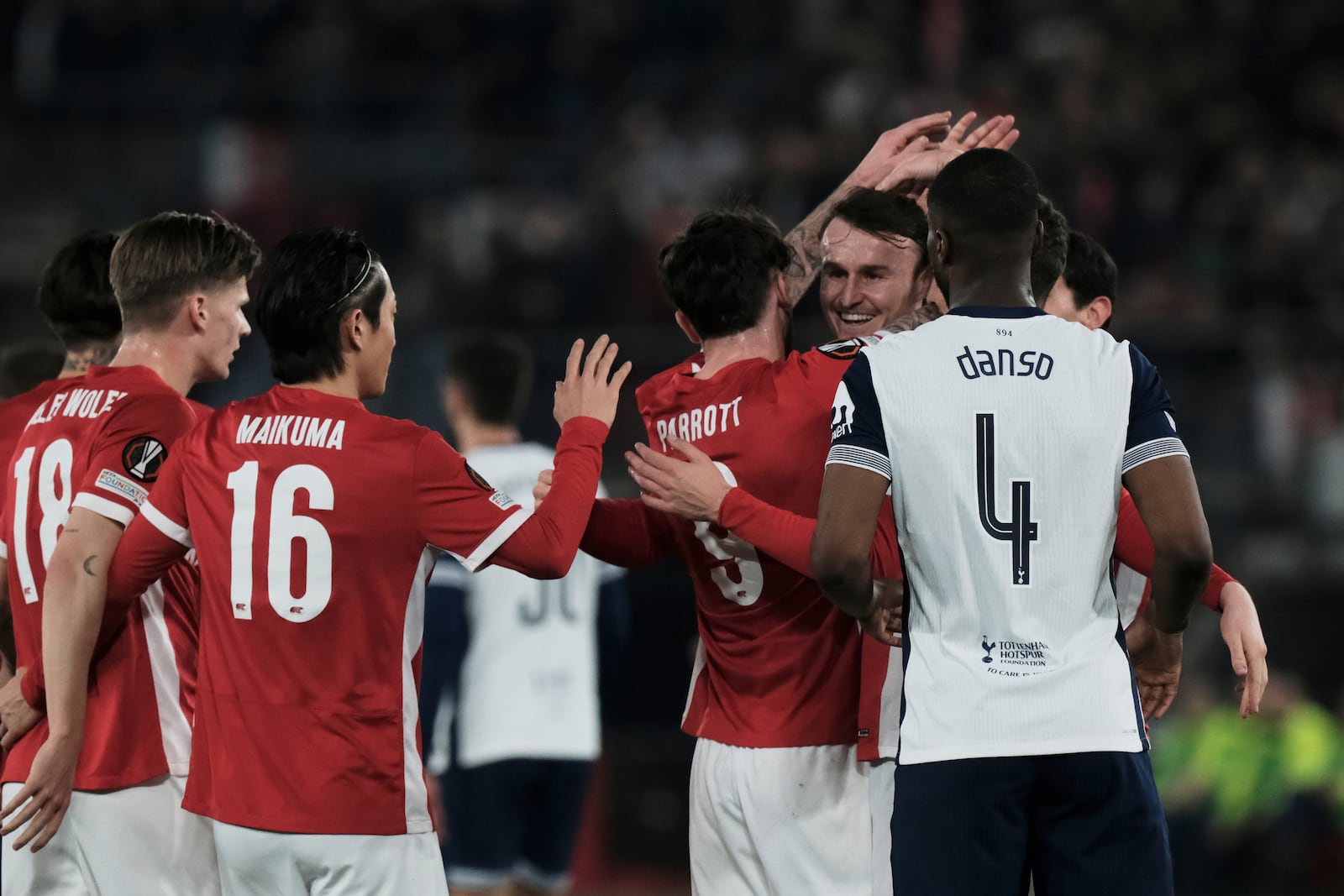 AZ Alkmaar's players celebrate after Tottenham's Lucas Bergvall scores an own goal during the Europa League round of 16 first leg soccer match between AZ Alkmaar and Tottenham Hotspur at the AFAS Stadium, in Alkmaar, Netherlands, Thursday, March 6, 2025. (AP Photo/Patrick Post)