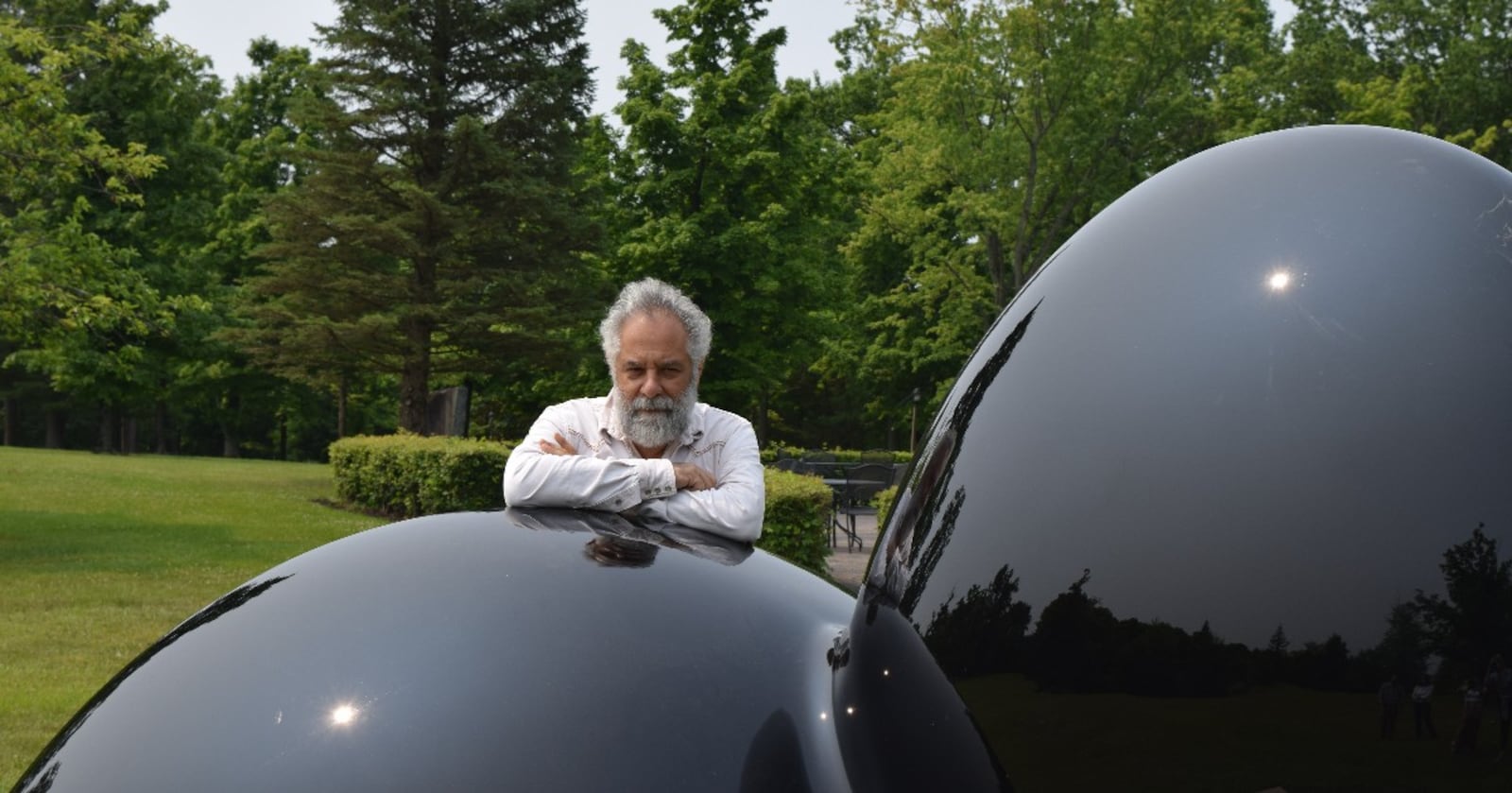 Artist Cosimo Cavallaro is seen with one of four sculptures of the “In Pieces” installation at Pyramid Hill in Hamilton. CONTRIBUTED