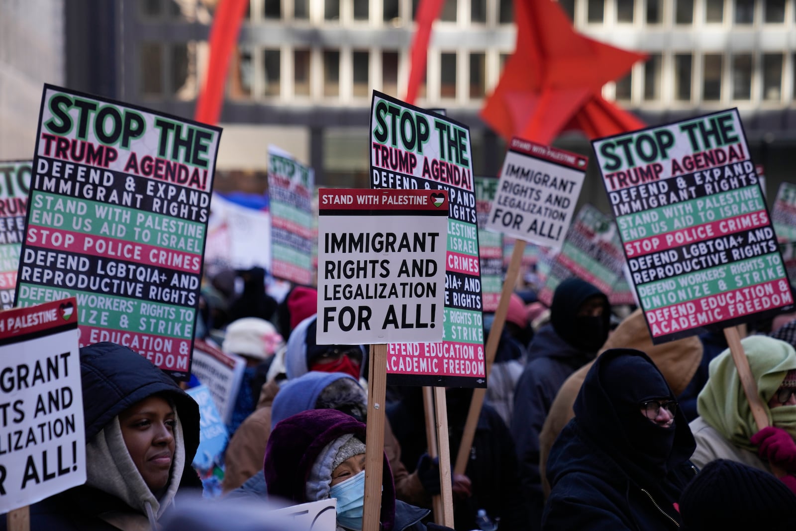 Anti-Trump protesters gather in Federal Plaza to rally for a number of issues, including immigrant rights, the Israel-Hamas war, women's reproductive rights, racial equality and others, on the day of President Trump's Inauguration, Monday, Jan. 20, 2025, in Chicago. (AP Photo/Erin Hooley)