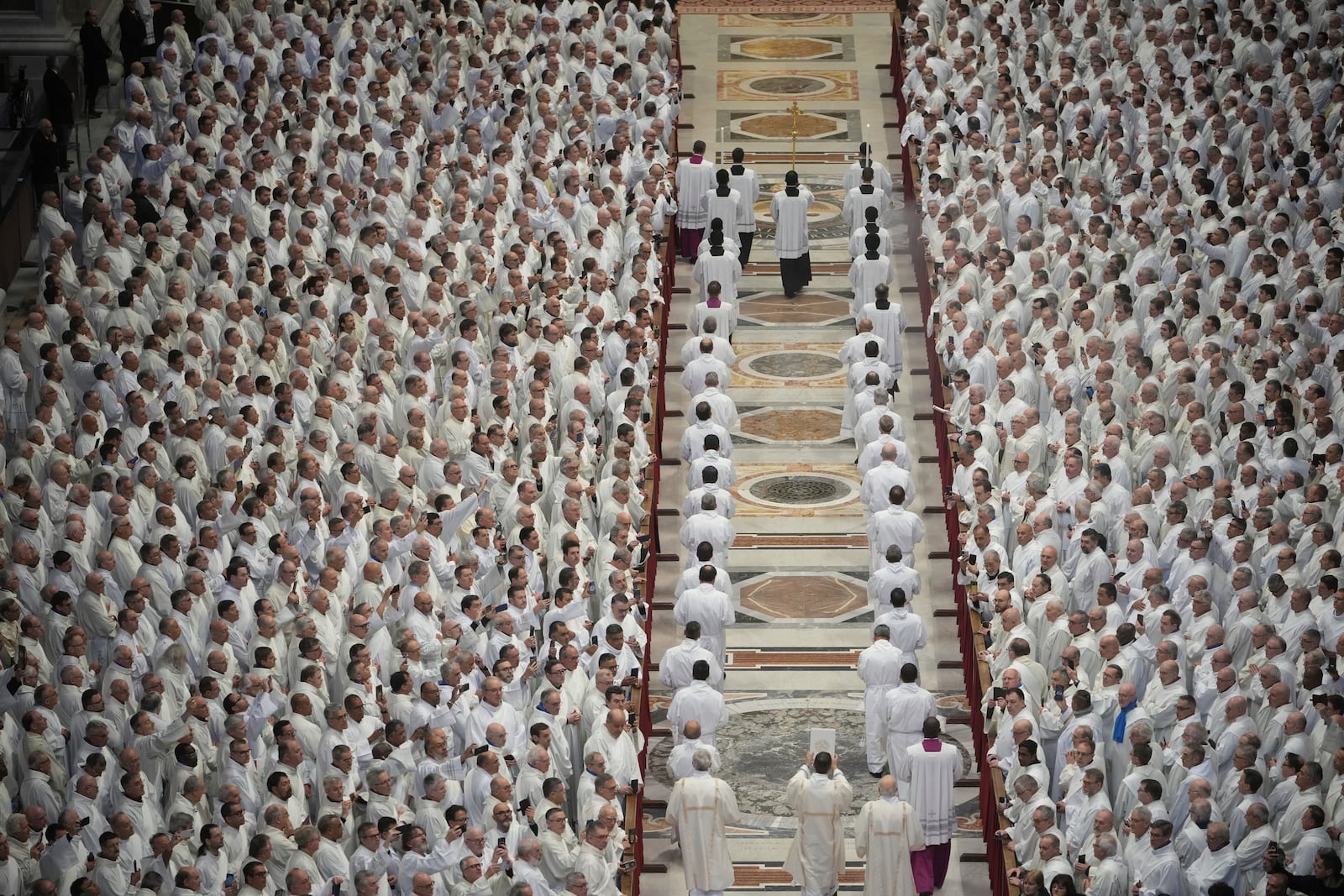 Deacons take part in a mass for their jubilee in St. Peter's Basilica at The Vatican that was supposed to be presided over by Pope Francis who was admitted over a week ago at Rome's Agostino Gemelli Polyclinic and is in critical conditions. (AP Photo/Alessandra Tarantino)