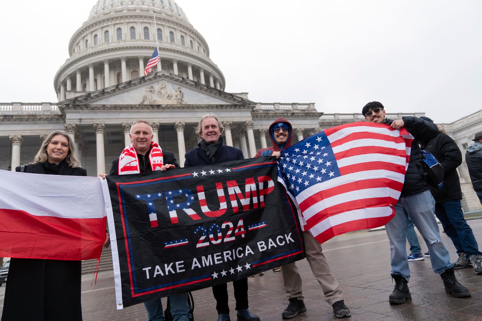 Supporters of President-elect Donald Trump take pictures as they celebrate outside of the U.S. Capitol, Sunday, Jan. 19, 2025, in Washington. (AP Photo/Jose Luis Magana)