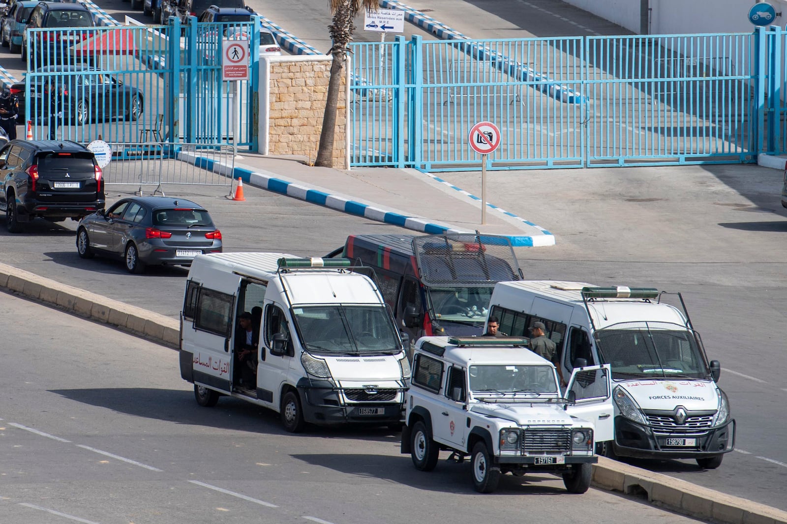 Moroccan security forces stand guard outside the border with the Spanish enclave of Ceuta, in Fnideq, Morocco, Monday, Sept. 16, 2024. (AP Photo)