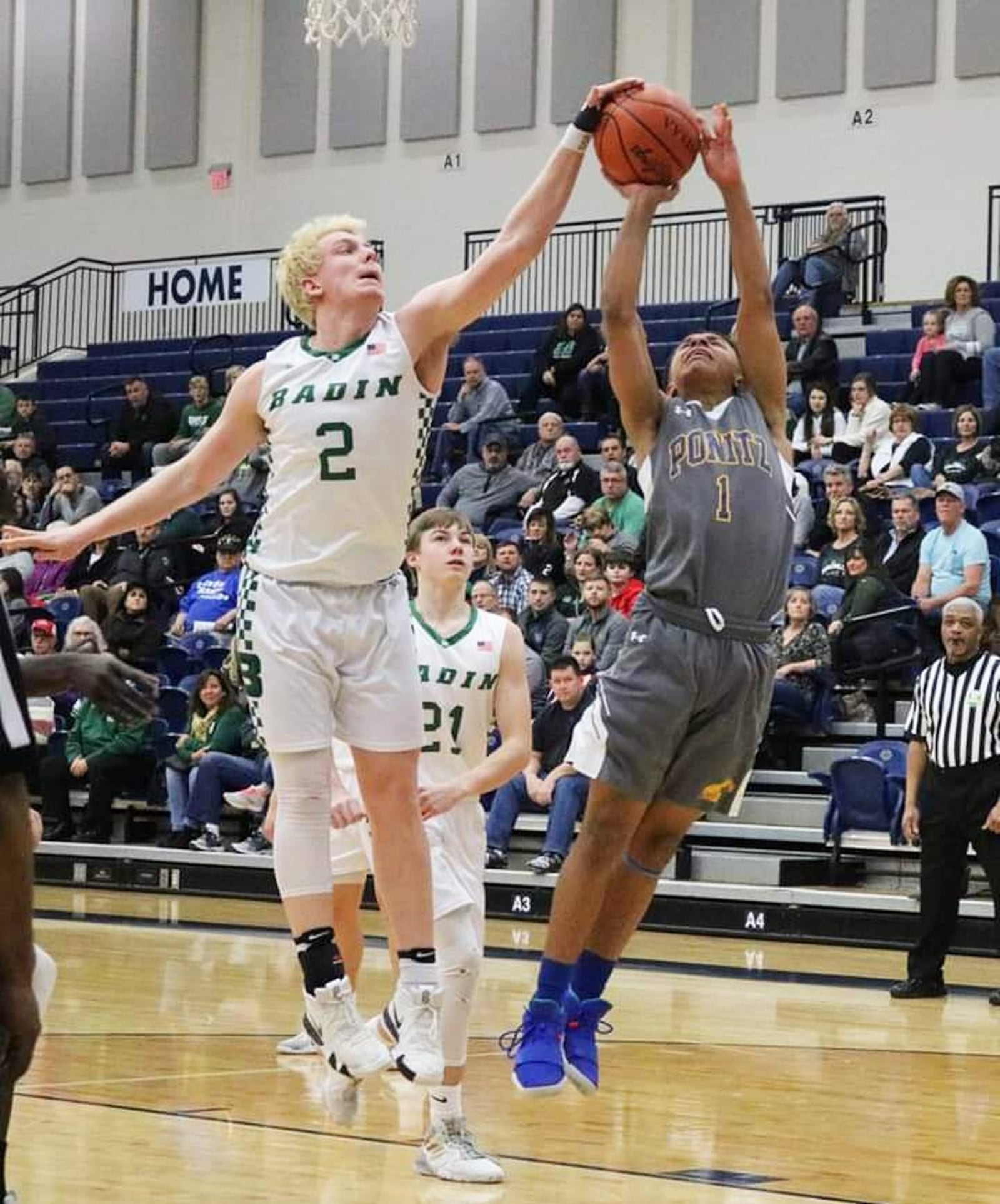 Badin’s Justin Pappas (2) blocks a shot by Max Scott of Ponitz during Friday night’s Division II sectional basketball game at Fairmont’s Trent Arena in Kettering. Badin won 54-33. CONTRIBUTED PHOTO BY TERRI ADAMS