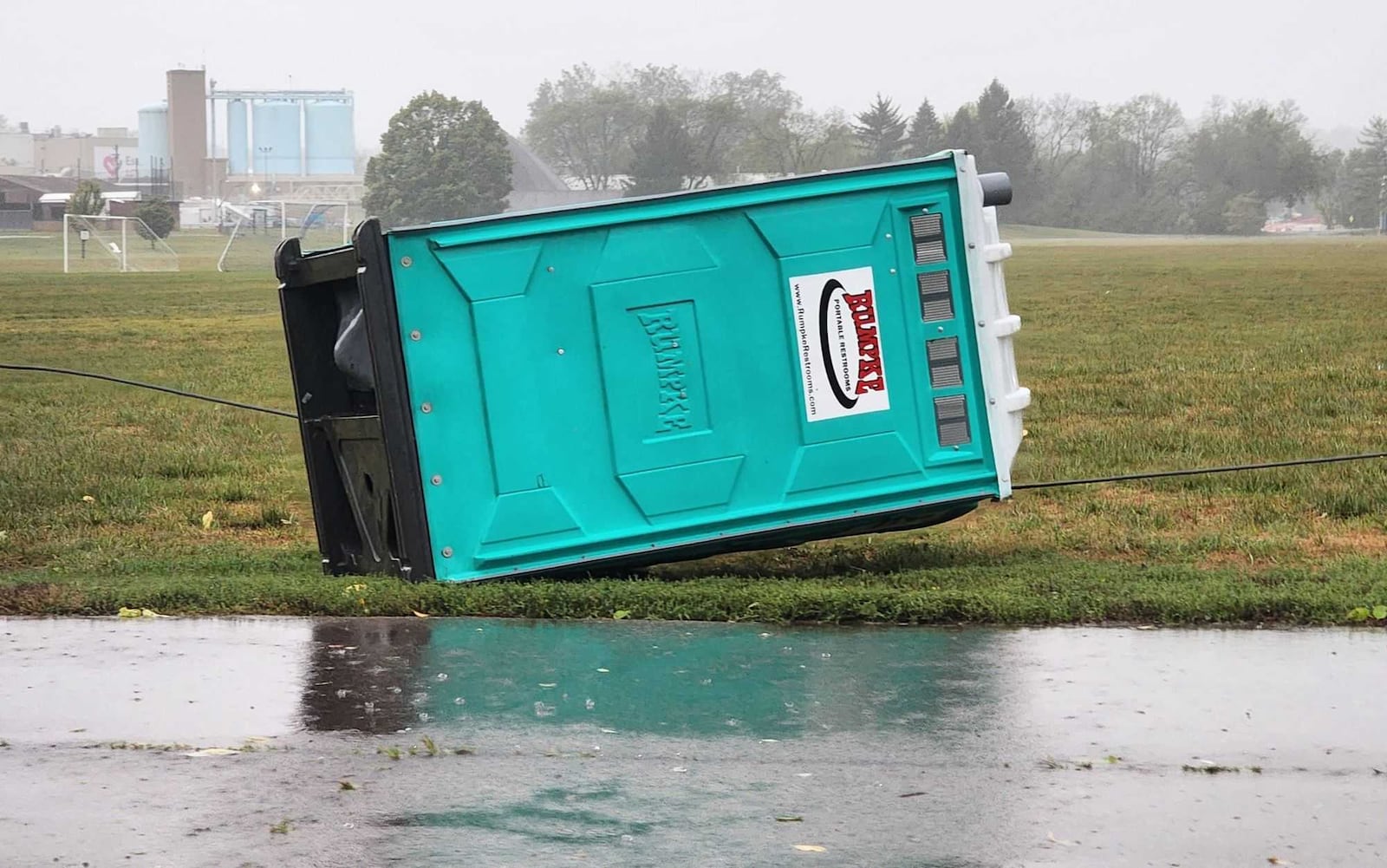 A portable toilet toppled during high wind and heavy rain Friday, Sept. 27, 2024, at the location of a large construction project on Main Street in Middletown. NICK GRAHAM/STAFF