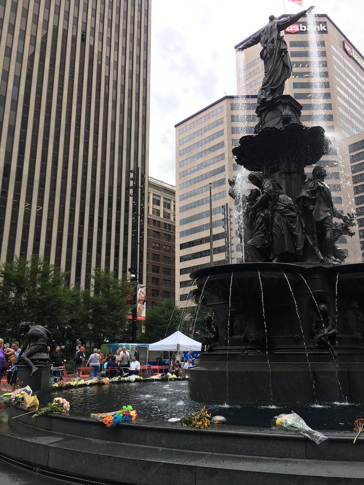 Photos: Locals honor three killed day after Fountain Square shooting