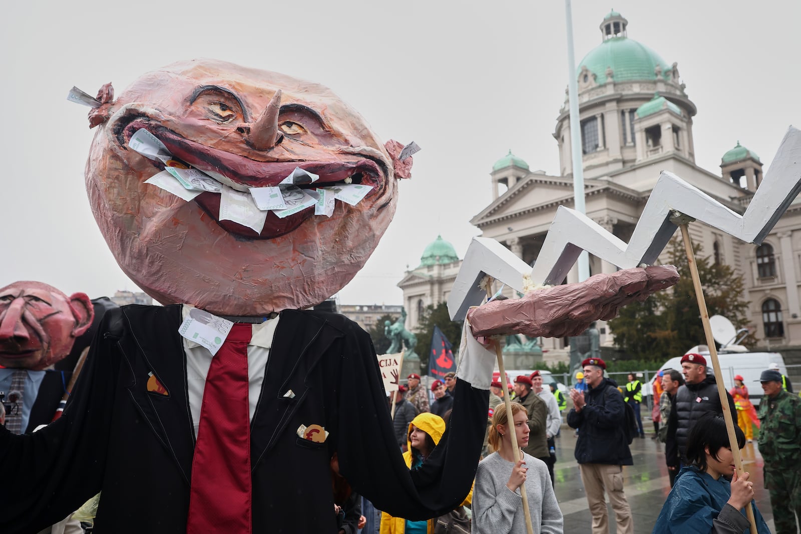 Effigies representing protesters' demands are displayed during a performance at a major rally against populist President Aleksandar Vucic and his government, in downtown Belgrade, Serbia, Saturday, March 15, 2025. (AP Photo/Armin Durgut)