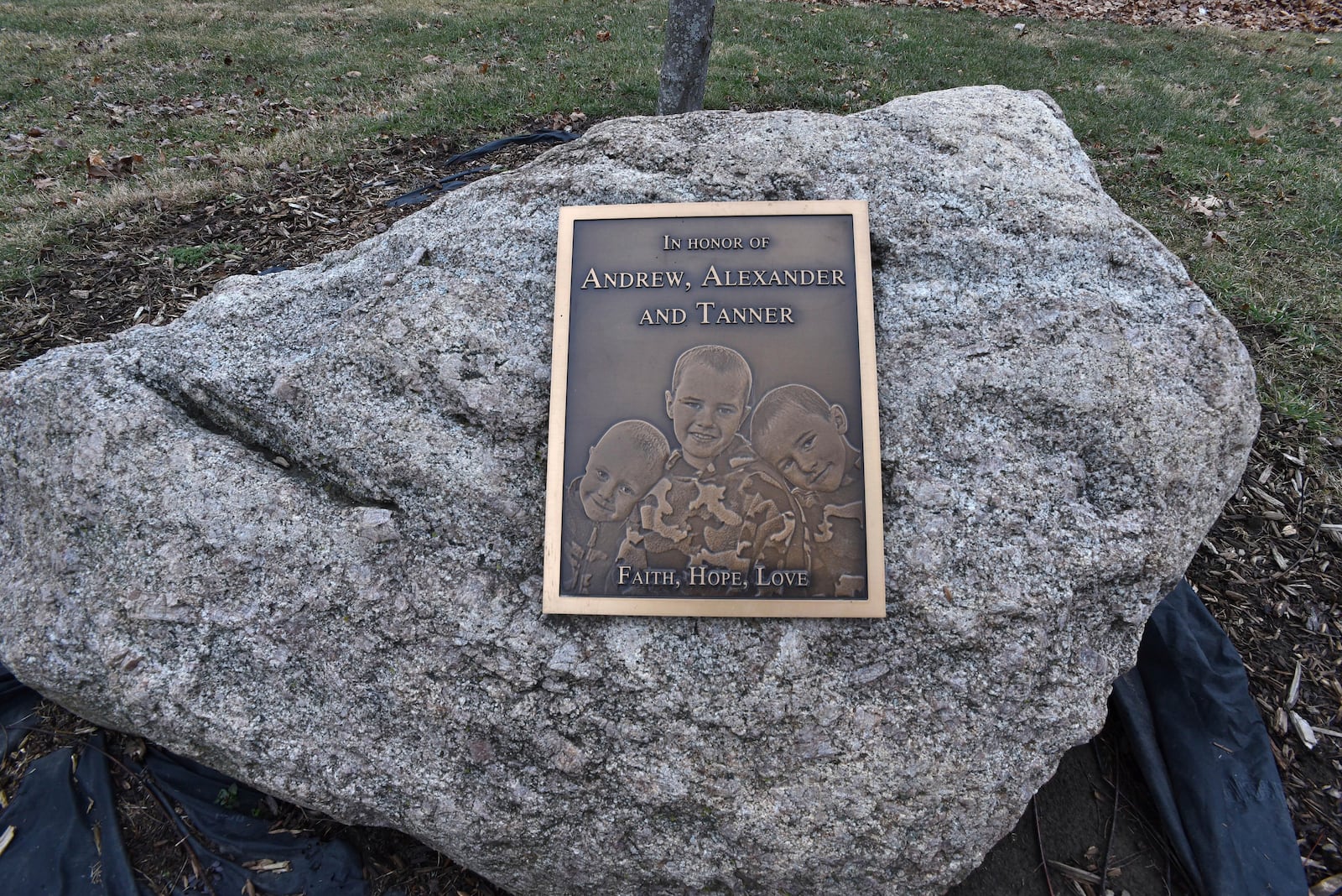 This plaque honors the missing Skelton brothers in the municipal park on the banks of Bean Creek in Morenci, Mich., on Jan. 27, 2017. (Dale G. Young/Detroit News via AP)