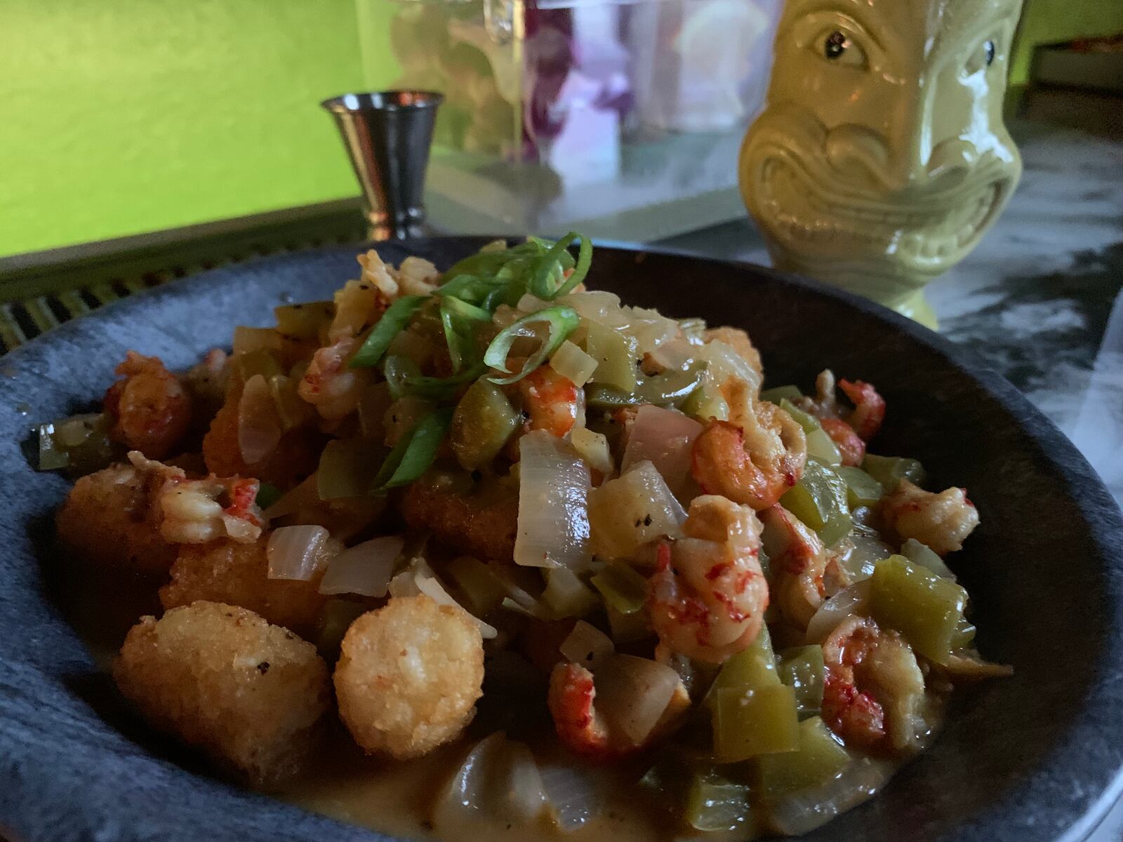 Crawfish Etoufée served over Tiki Tots ($16.95) at Backwater Voodoo in Miamisburg.