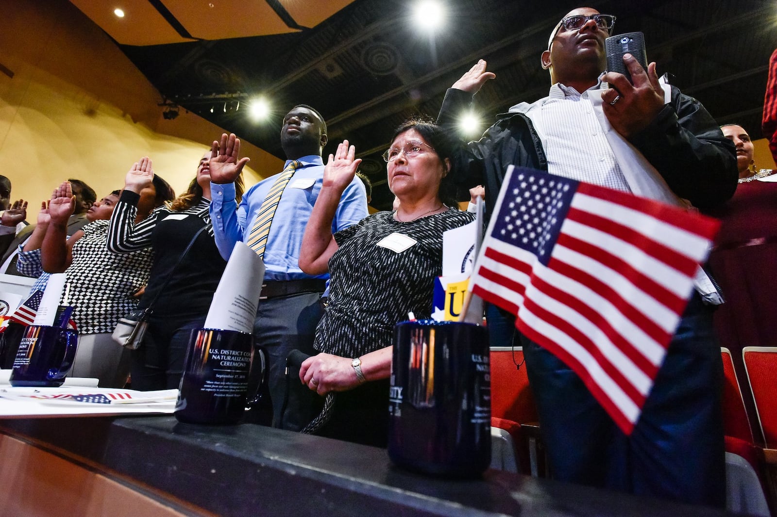 Ninety-nine people became U.S. citizens during a naturalization ceremony Monday, Sept. 17 at Miami University Hamilton’s Parrish Auditorium in Hamilton. 