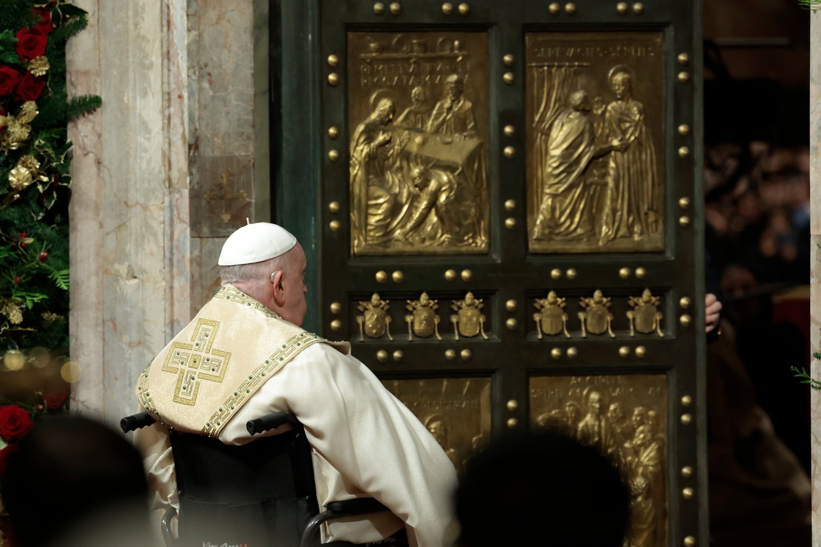 Pope Francis opens the Holy Door to mark the opening of the 2025 Catholic Holy Year, or Jubilee, in St. Peter's Basilica, at the Vatican, Dec. 24, 2024. (Remo Casilli/Pool Photo via AP)