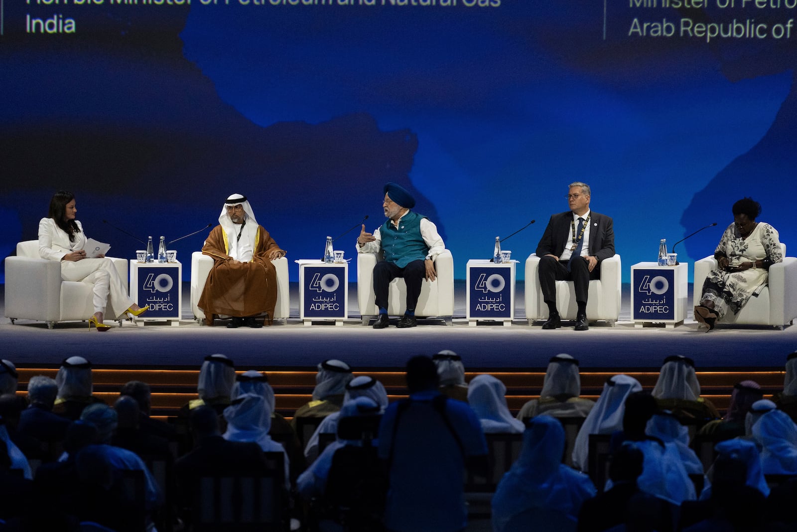 India's Minister of Petroleum and Natural Gas Hardeep Singh Puri, center, talks in a panel as UAE Minister of Energy and Infrastructure Suhail al-Mazrouei, second left, Egypt's Minister of Petroleum and Mineral Resources of Egypt Karim Badawi, second right, and Uganda's Minister of Energy and Mineral Development Ruth Nankabirwa Ssentamu look on during the the inaugural session of annual Abu Dhabi International Petroleum Exhibition and Conference (ADIPEC) in Abu Dhabi, United Arab Emirates, Monday, Nov. 4, 2024. (AP Photo/Altaf Qadri)