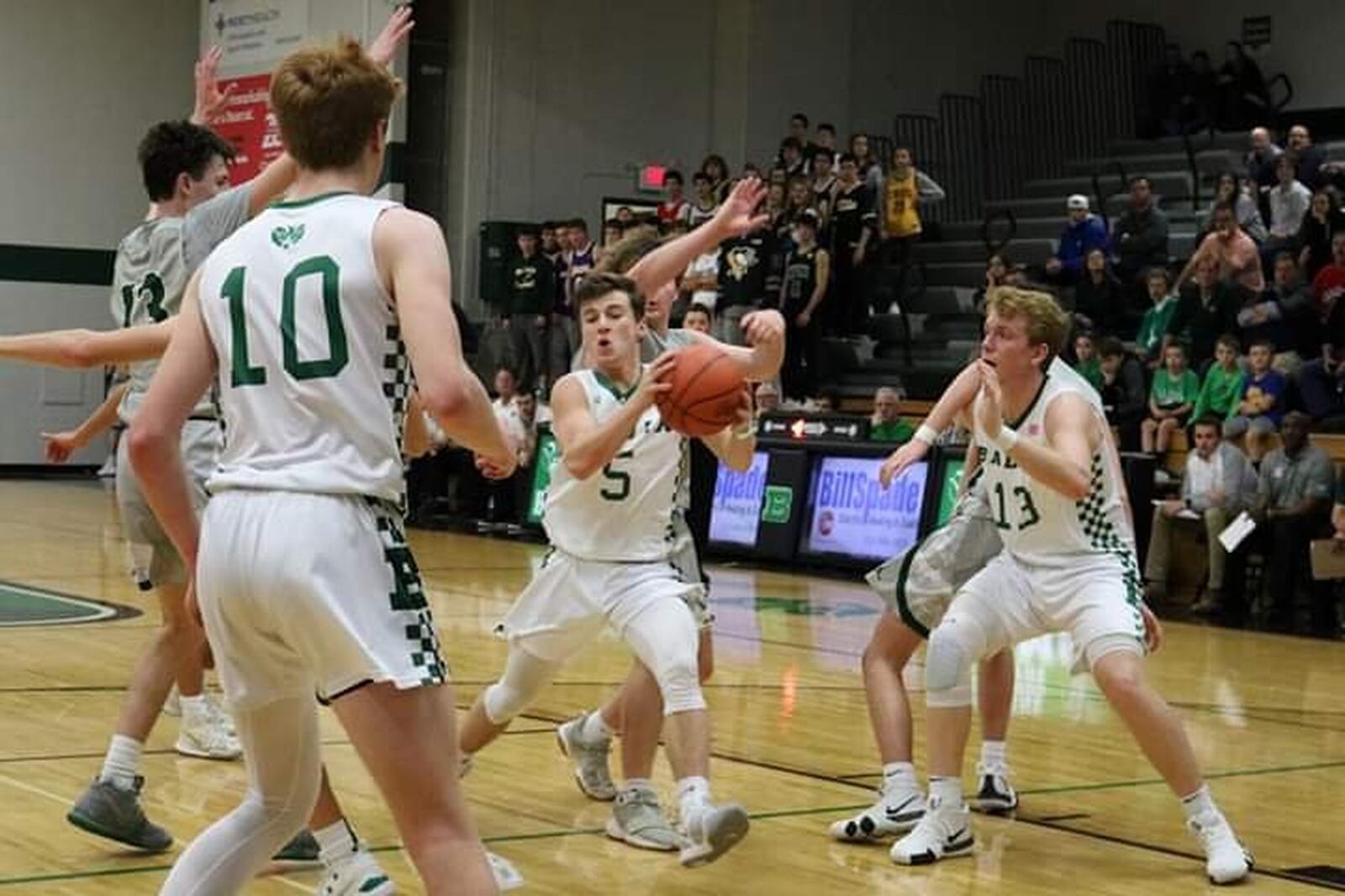 Badin’s Donovan Watkins (5) drives the lane between teammates Zach Switzer (10) and Justin Pappas (13) during Friday night’s game against McNicholas at Mulcahey Gym in Hamilton. McNick won 47-45. CONTRIBUTED PHOTO BY TERRI ADAMS