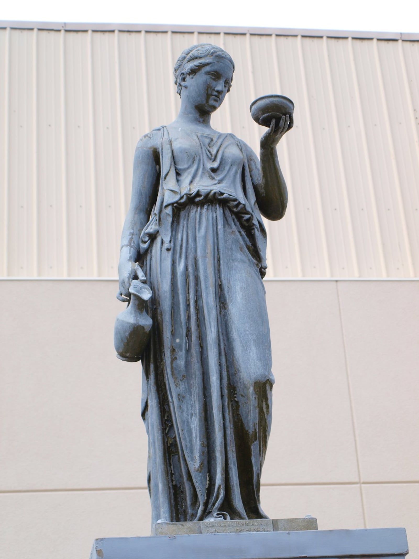 The statue of the Greek goddess Hebe was the first public water fountain in Hamilton. It was relocated in 2013 to a pocket park on the corner of High Street and Martin Luther King Blvd., before being struck by a vintage car in October. FILE PHOTO